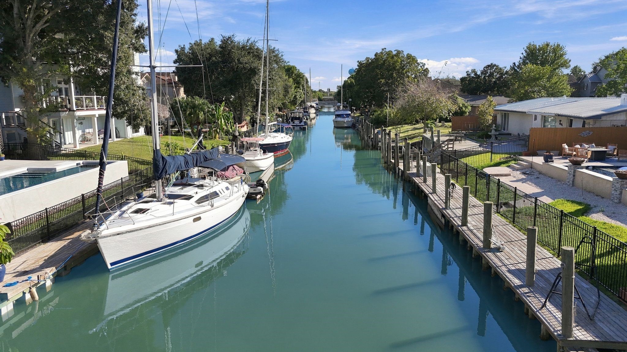 Charming waterfront property with private boat dock access along a serene canal, leading to Clear Lake and the Bay.