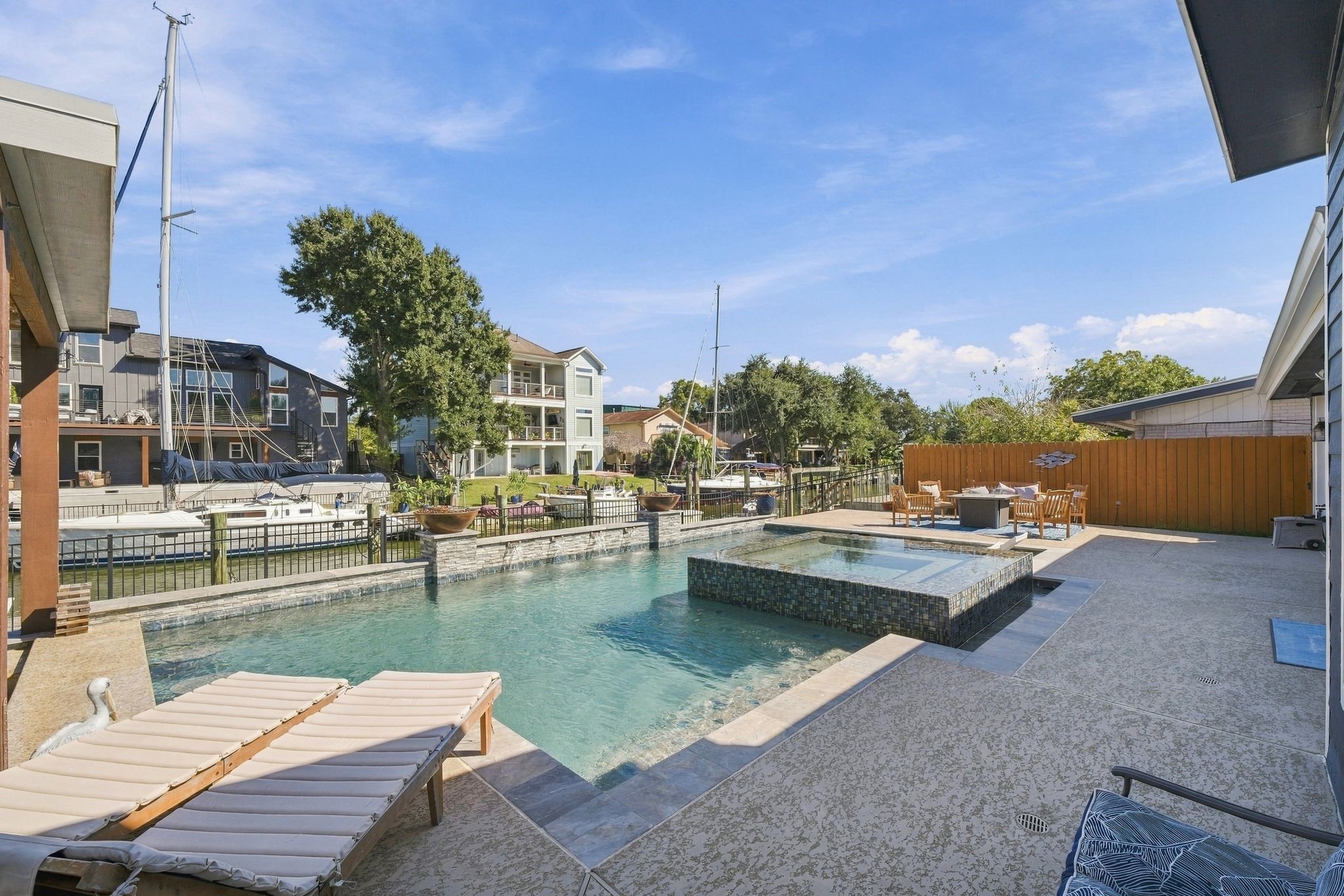 Lounge by the pool or take your boat to the lake. This home has a stunning pool and spa, spacious patio, and direct dock access for boating adventures.