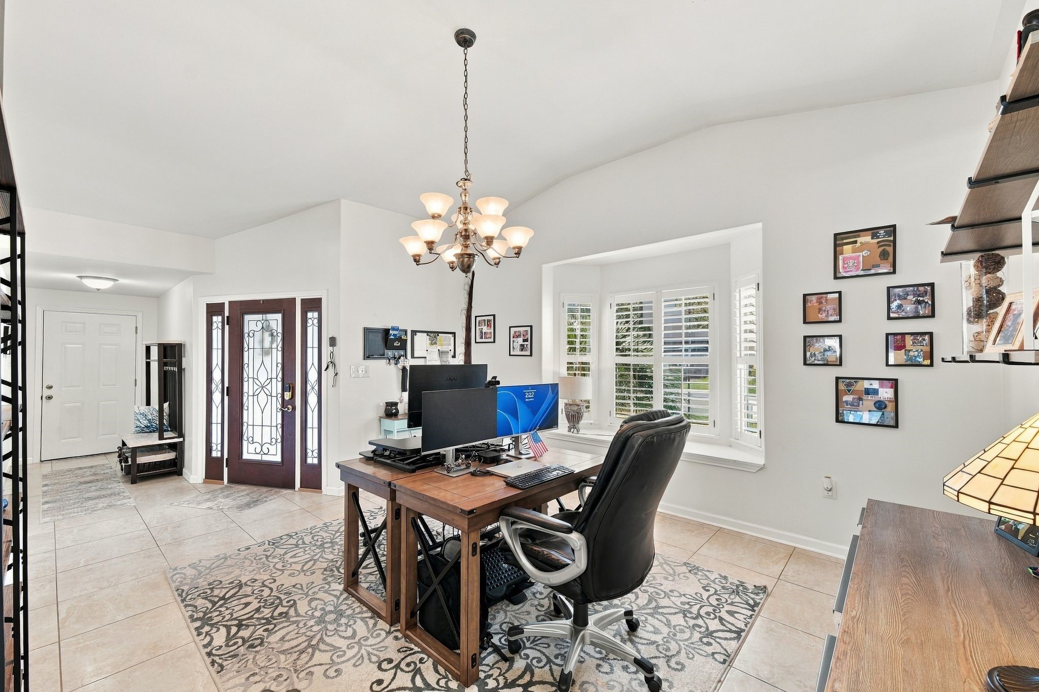 The dining room is currently being used as a home office. The dining room is currently being used as a home office.
