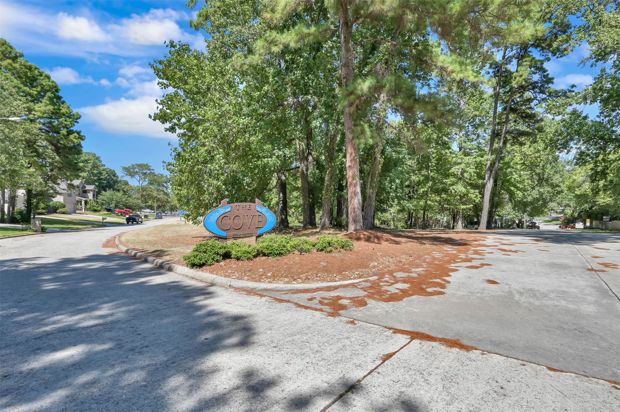 Entry driveway with The Cove Condominium sign