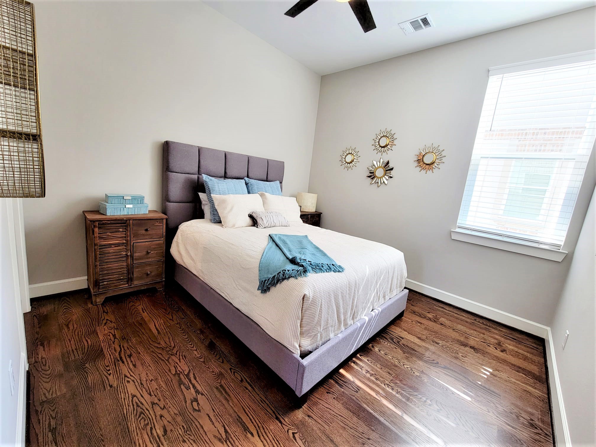Bedroom 3 space with natural light queen bed.