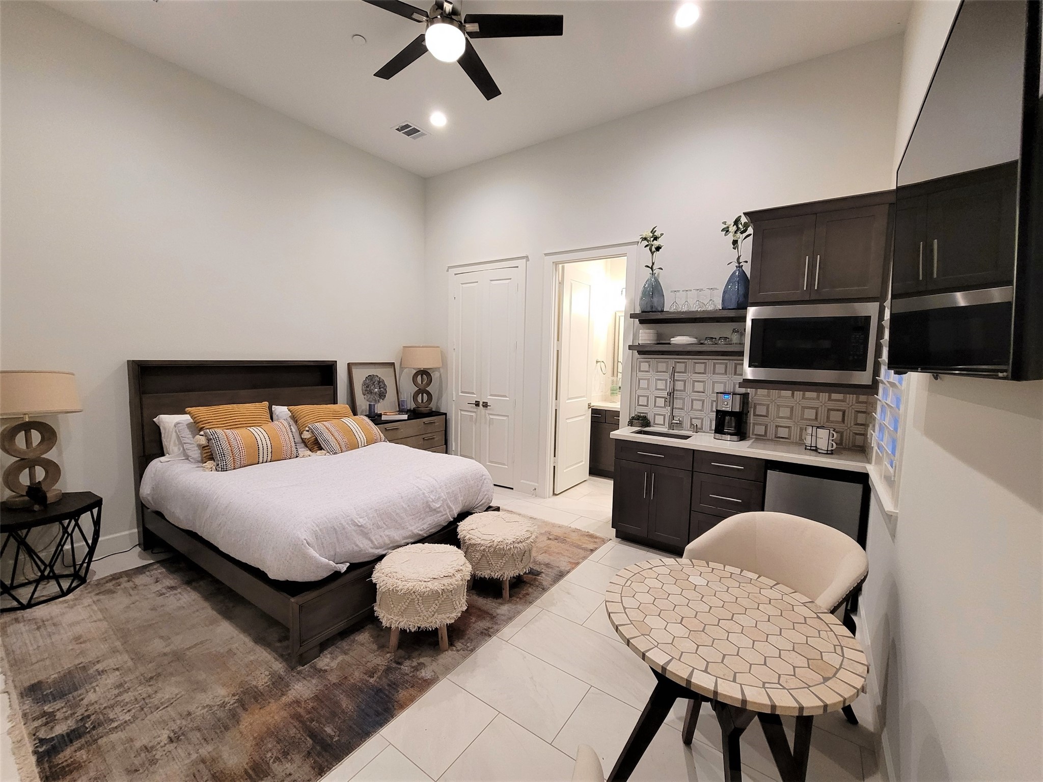 First floor bedroom with kitchenette, washer/dryer and a walk in shower. First floor bedroom with kitchenette, washer/dryer and a walk in shower.