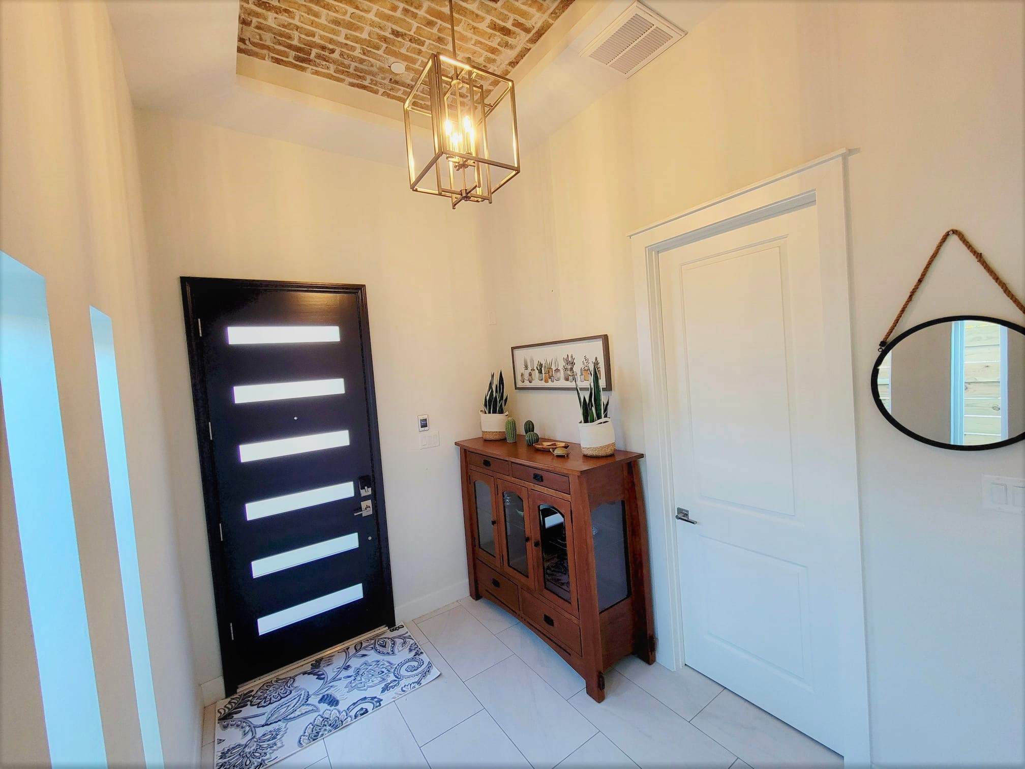 Charming entry foyer with brick ceiling design. Soaring 12 ft ceilings! Charming entry foyer with brick ceiling design. Soaring 12 ft ceilings!