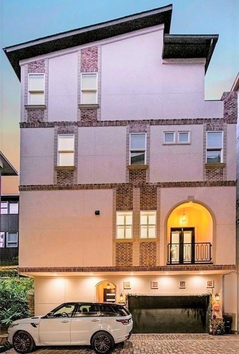 Modern Mediterranean style. Beautiful stucco and brick all around.