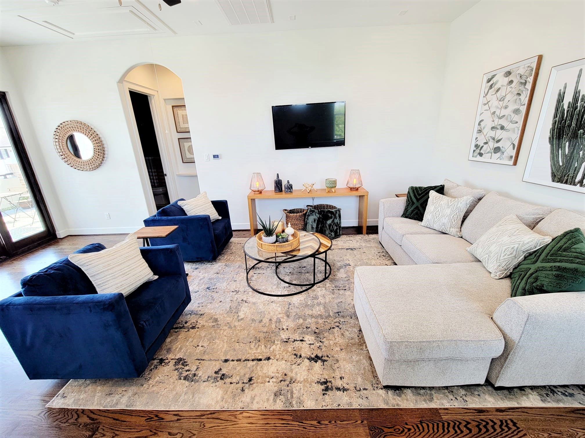 Loft / Game room with full size sitting area and double sliding doors to patio
