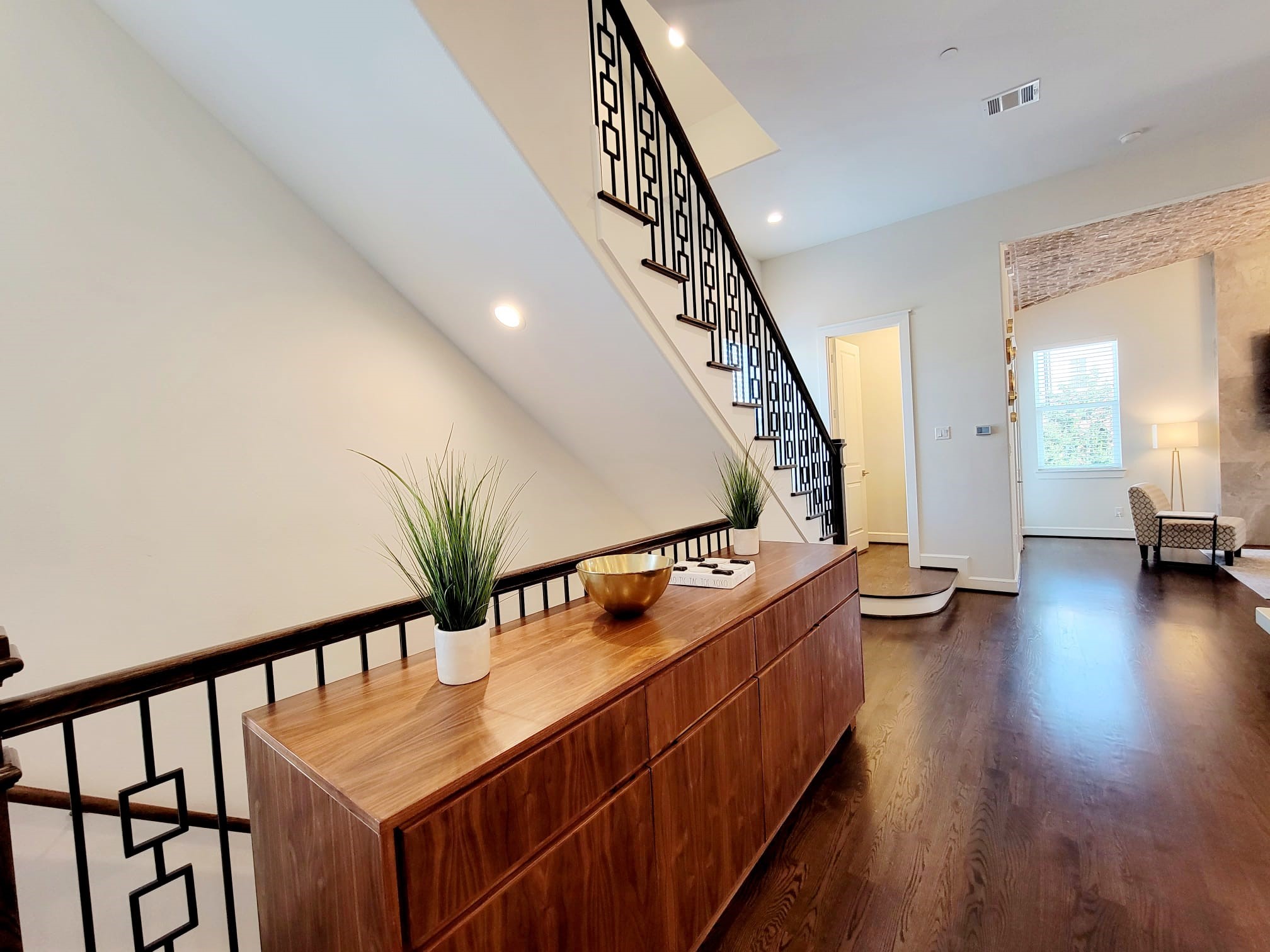 Solid hardwood floors alongside designer touches all around.
No carpet.