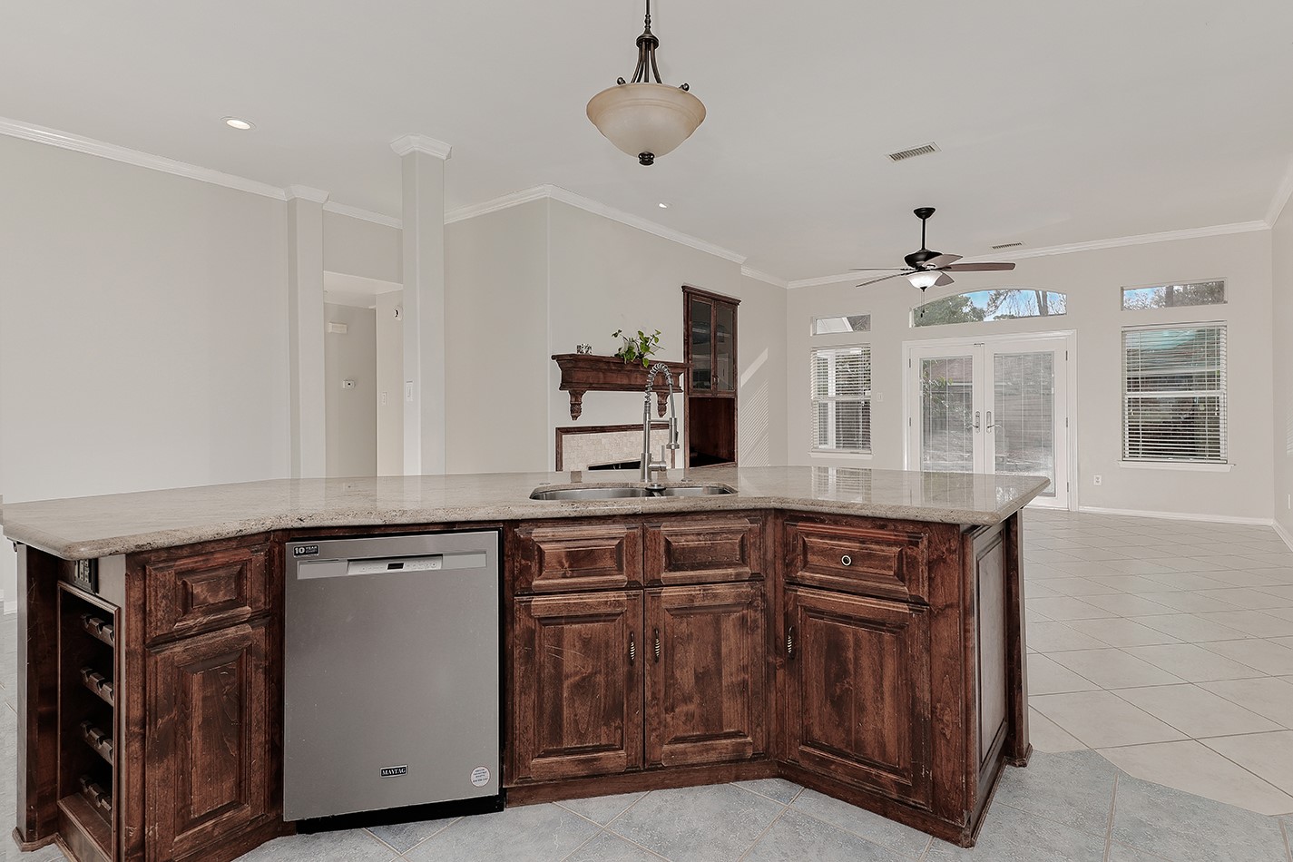 This photo showcases a spacious open-concept kitchen and living area.