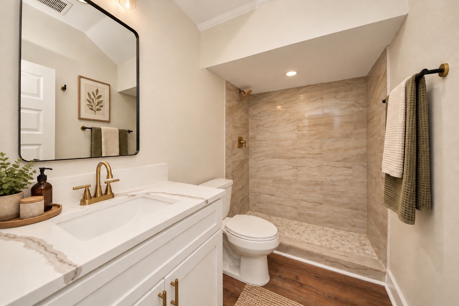 Conveniently located on the first floor, this full bathroom features a modern vanity and tiled walk-in shower, providing easy access from the main living areas without having to go upstairs. | Virtually Staged