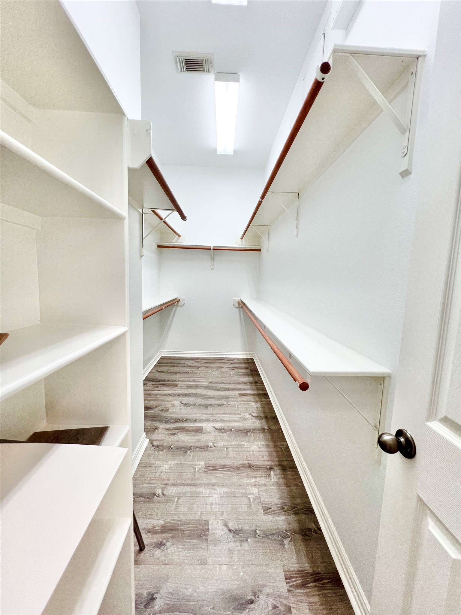 nice big walk in primary bedroom  closet