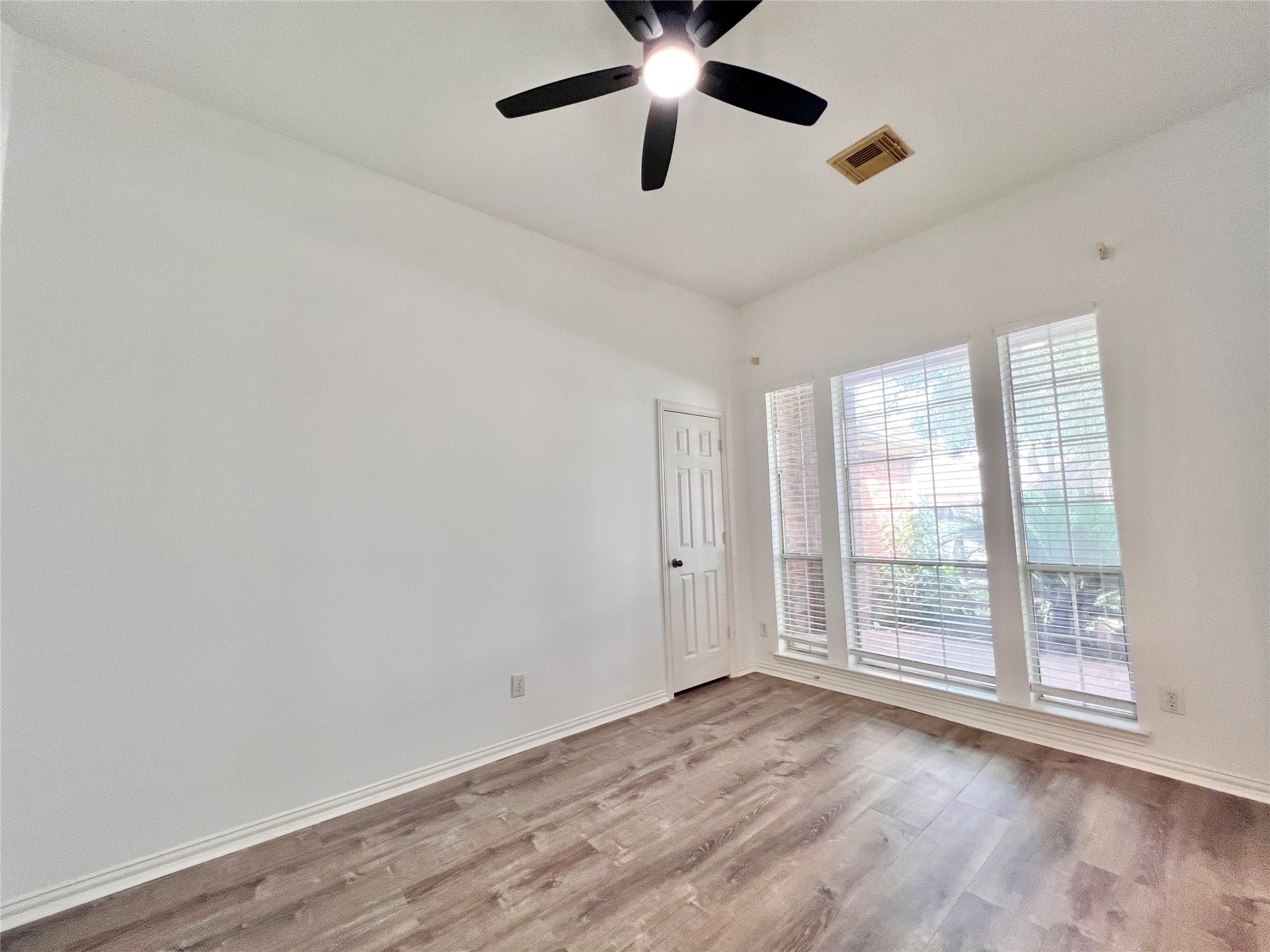 4th Bedroom has tall windows over looking to Front Porch