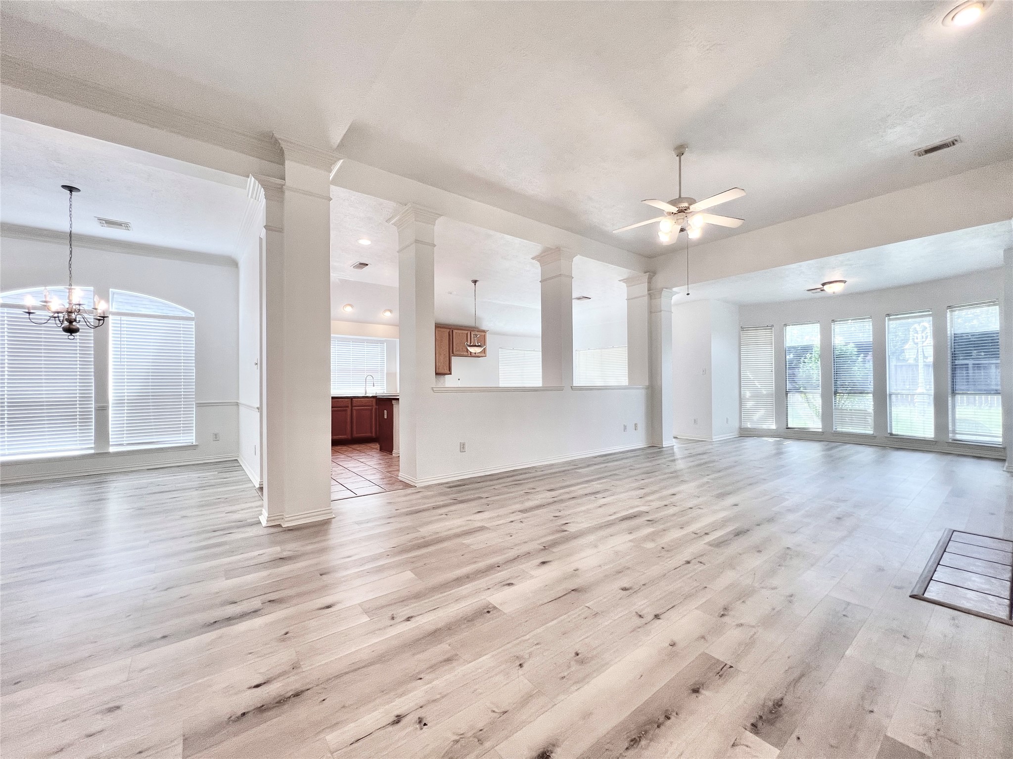 Spacious and open floor plan with high ceilings and beautiful laminate floors
