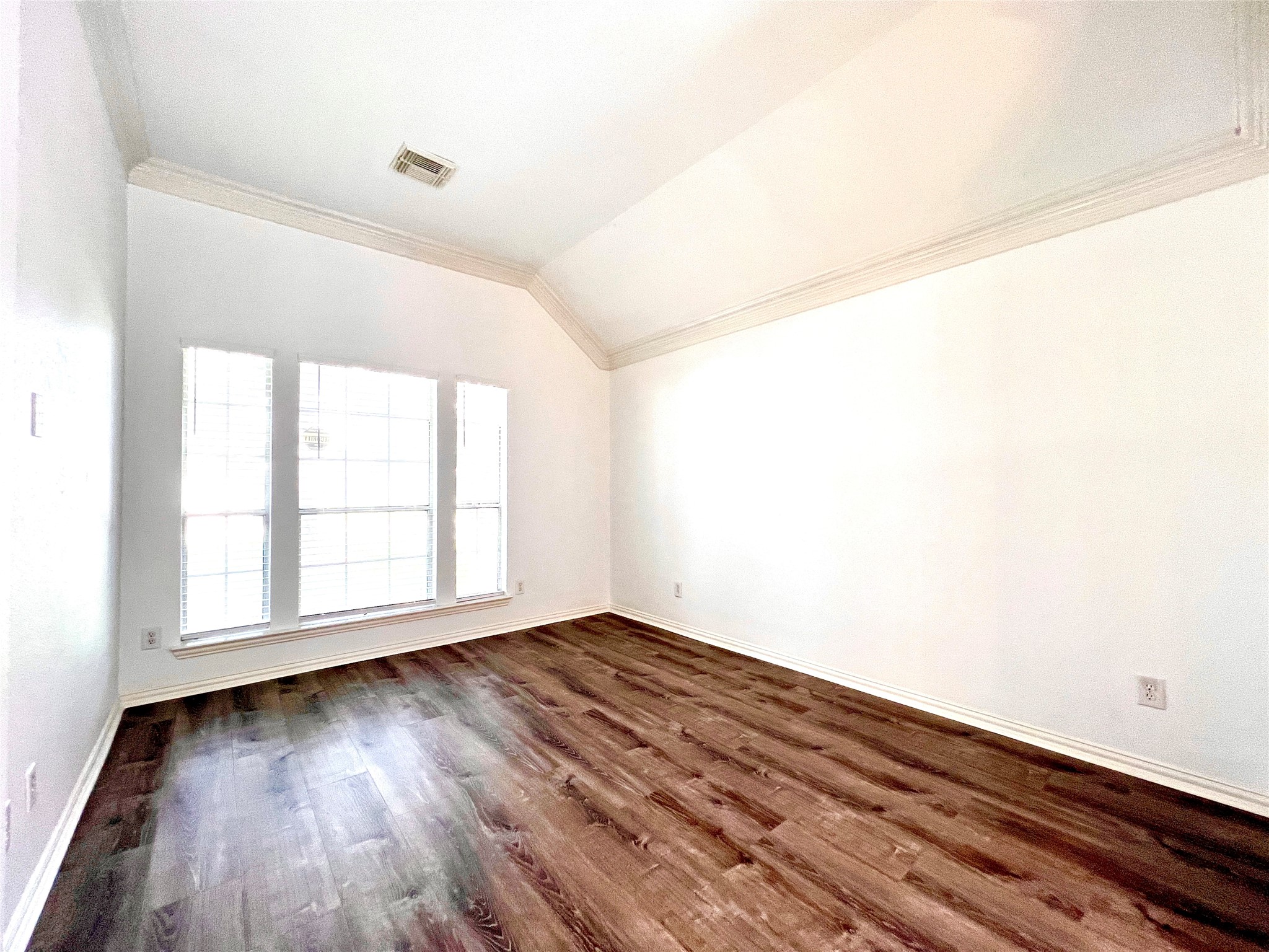 Formal Living room with nice windows looking over to the front yard with Mature Oak Trees