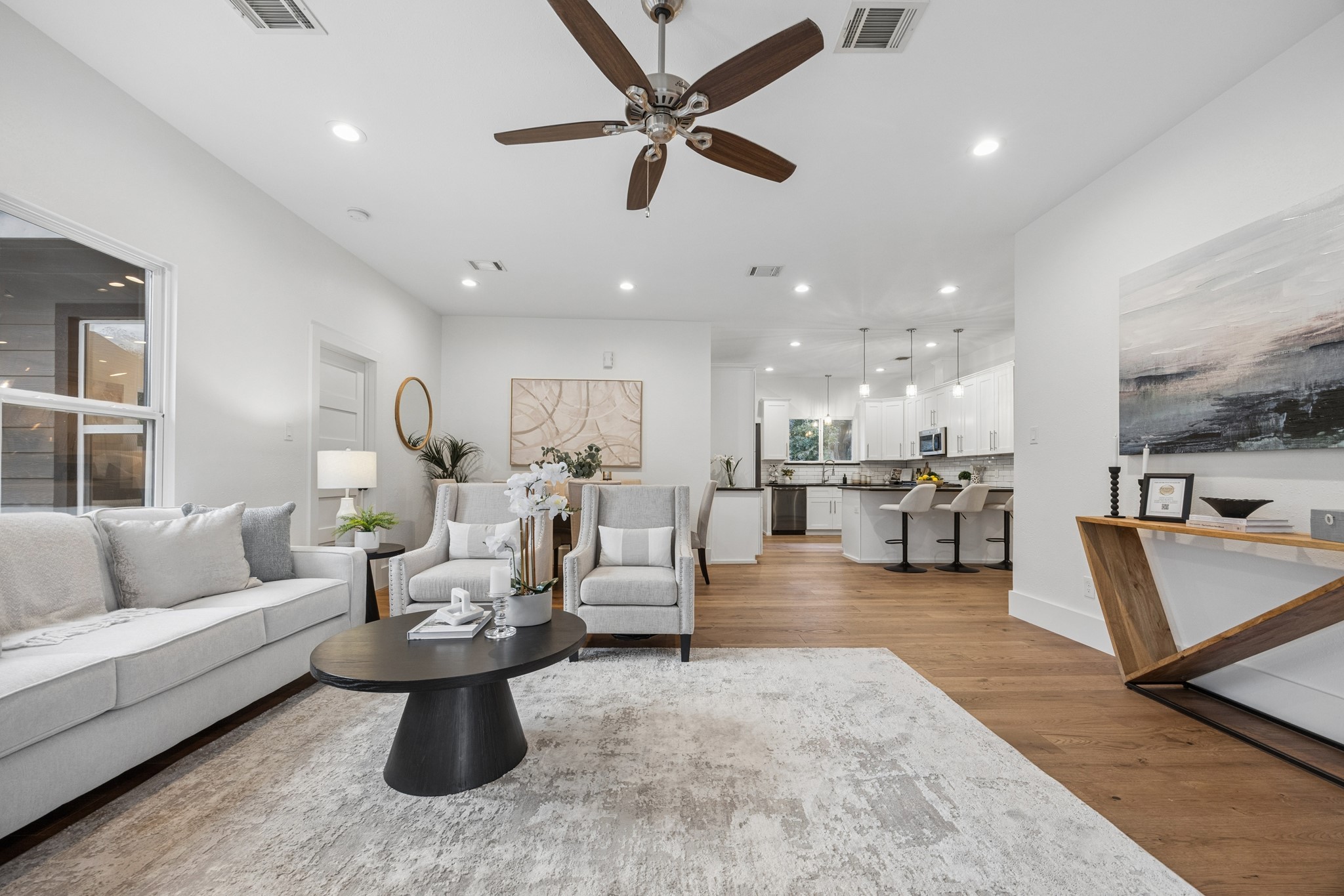 Open-concept living area and a stylish kitchen with a spacious island perfect for entertaining.