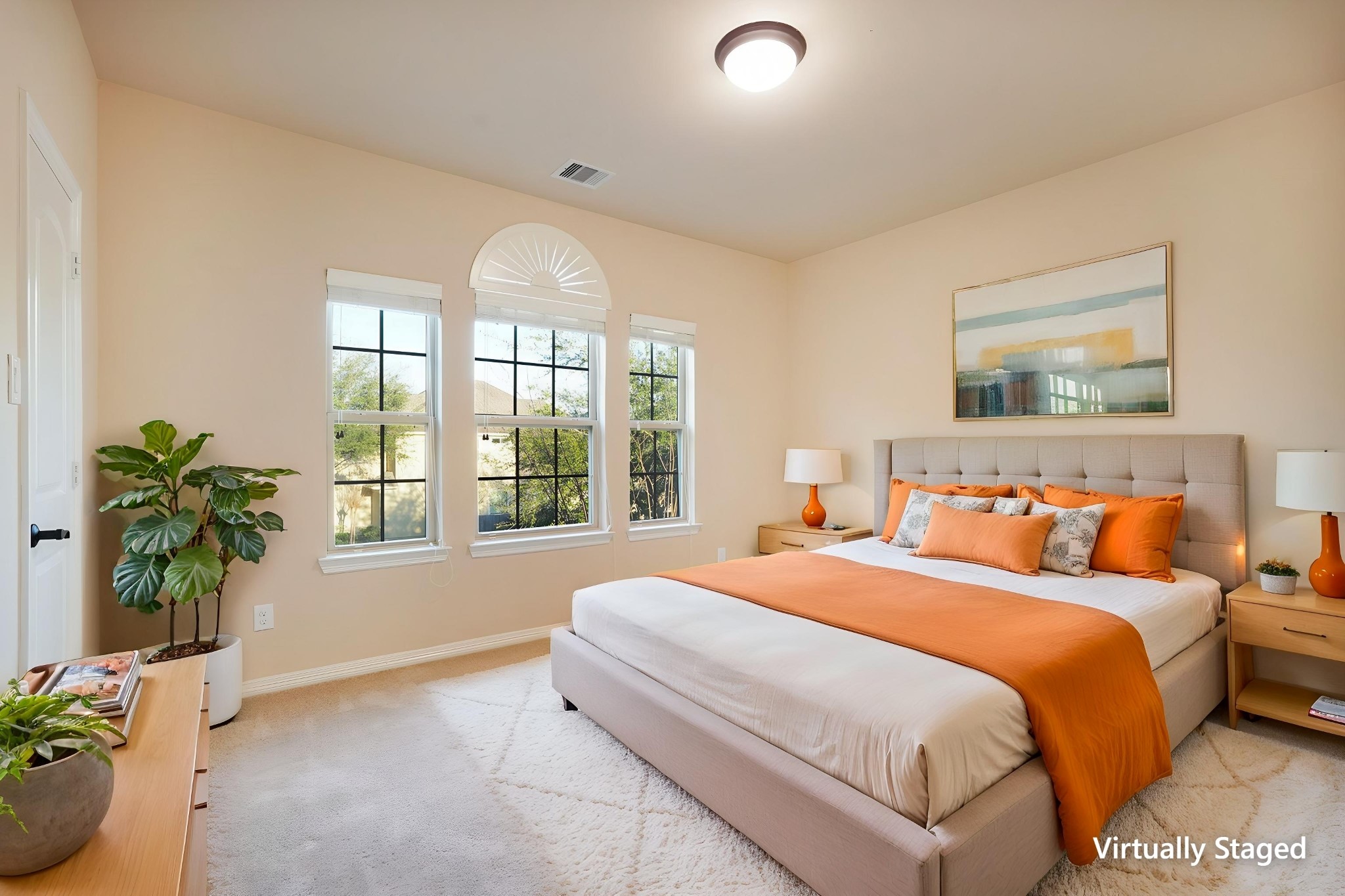 SECOND Flr-Bed#4: *Virtually Staged* This bright, large bedroom features neutral walls, a plush carpet, and a large window with a decorative arch, offering plenty of natural light.
