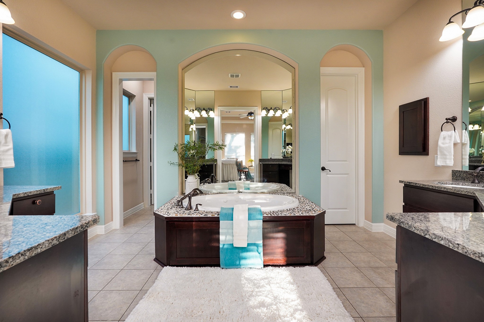 Spa Resort Primary Bathroom.  Split sinks, seperate shower and large closet.