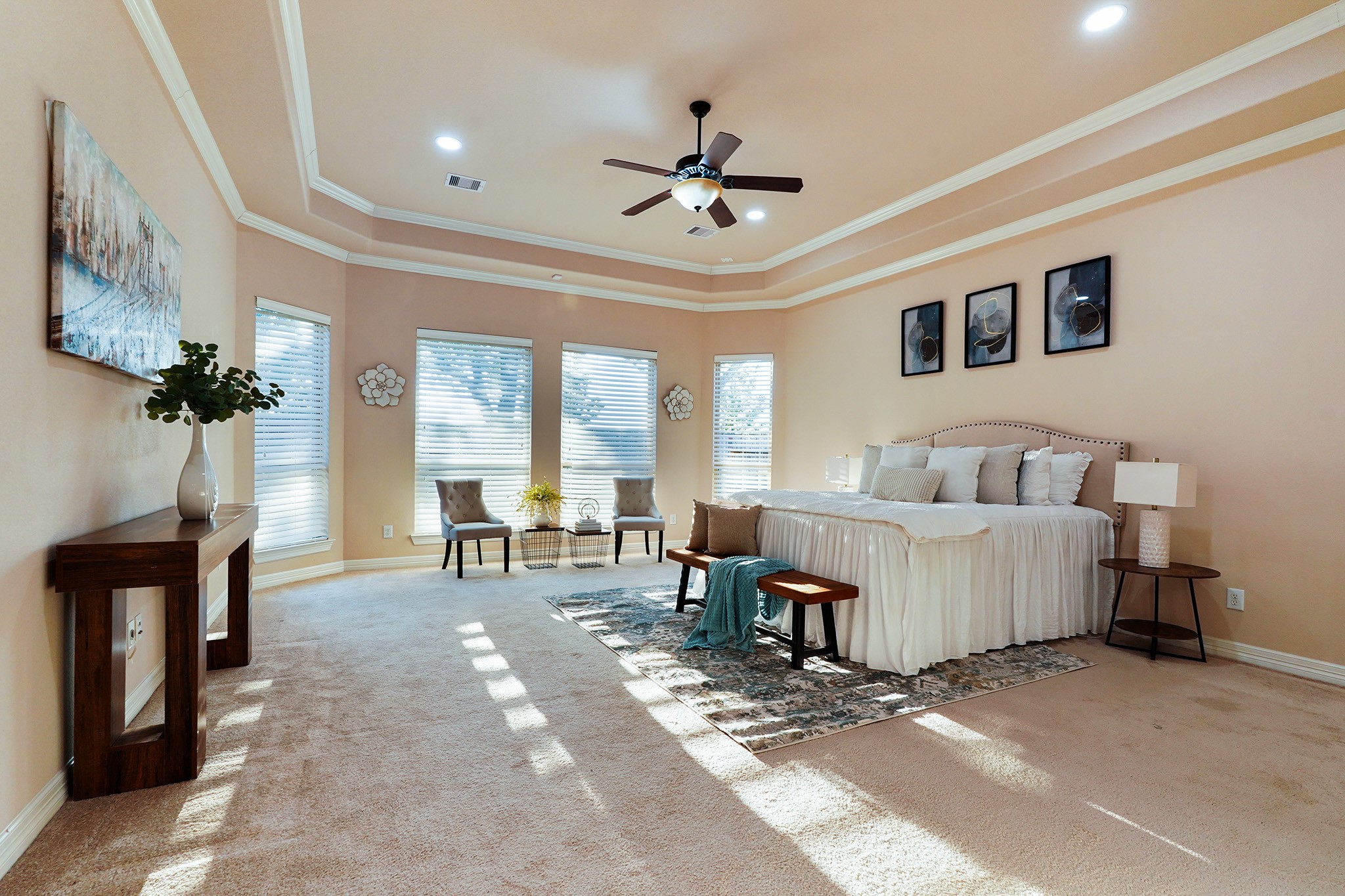 Oversized Primary Bedroom lush with light from perfectly placed windows.