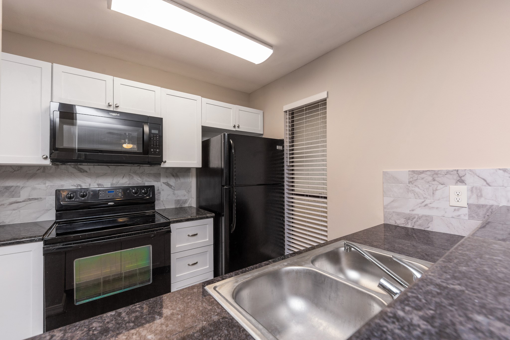 The granite countertops in this home are a wonderful feature.