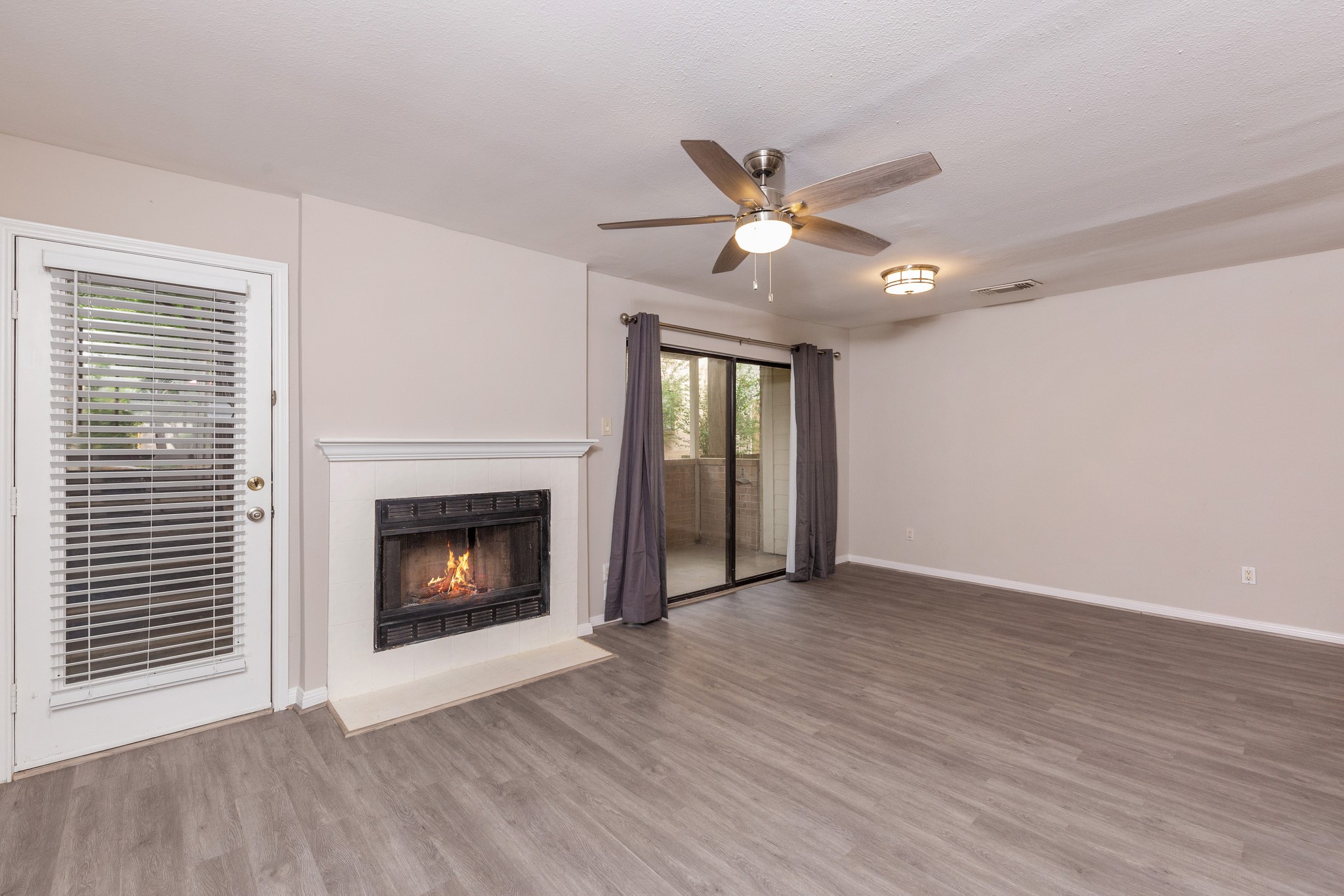 As you enter the home, you are greeted by an inviting fireplace. As you enter the home, you are greeted by an inviting fireplace.