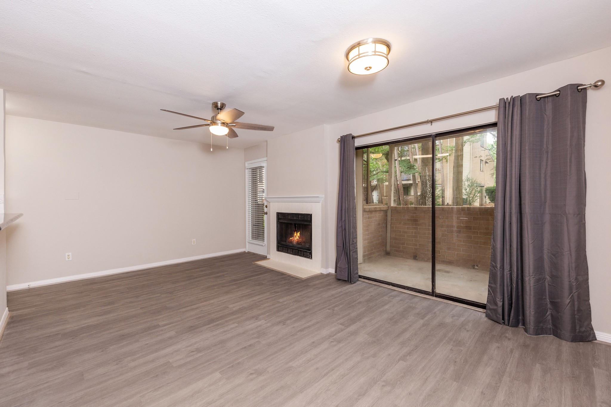 The large windows overlook the back patio, which in turn offers a view of the back greenspace. The large windows overlook the back patio, which in turn offers a view of the back greenspace.