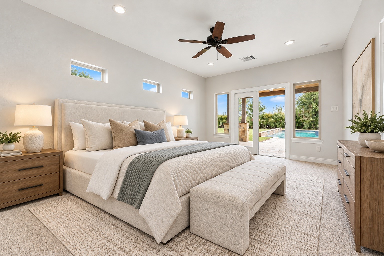 The casitas private bedroom offers direct access to the patio and pool views through French doors, with abundant natural light throughout. Virtually staged.