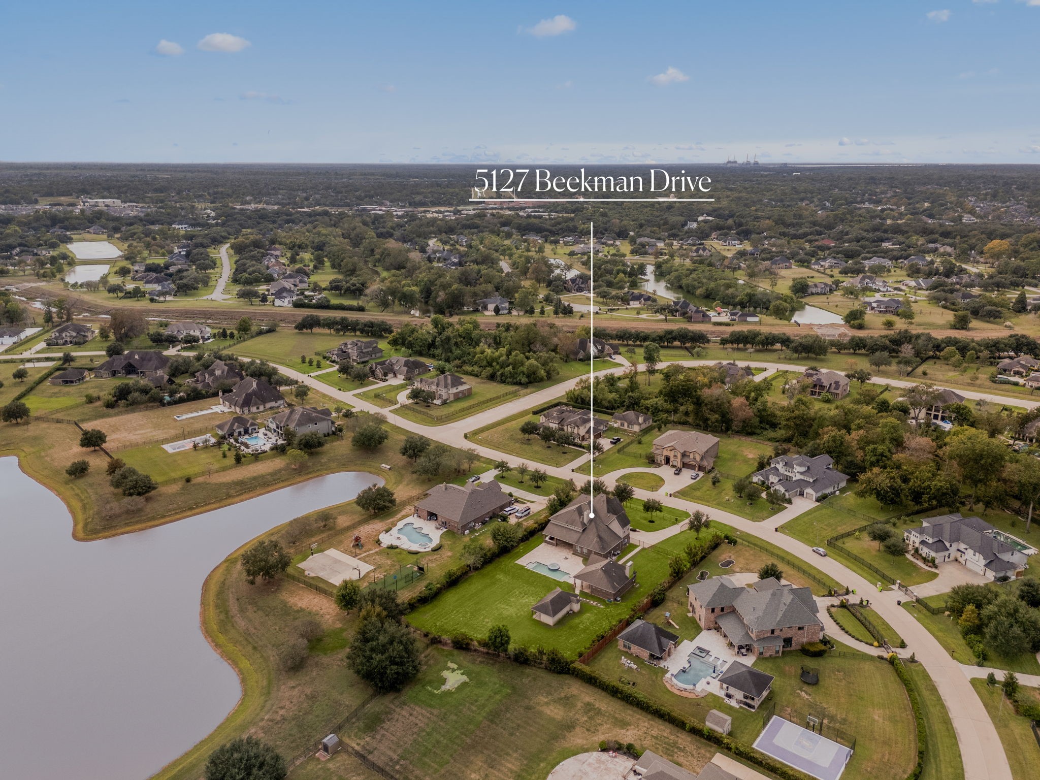 This view showcases the homes prime positioning within the community, with easy access to the neighborhoods scenic lake and surrounding green space.