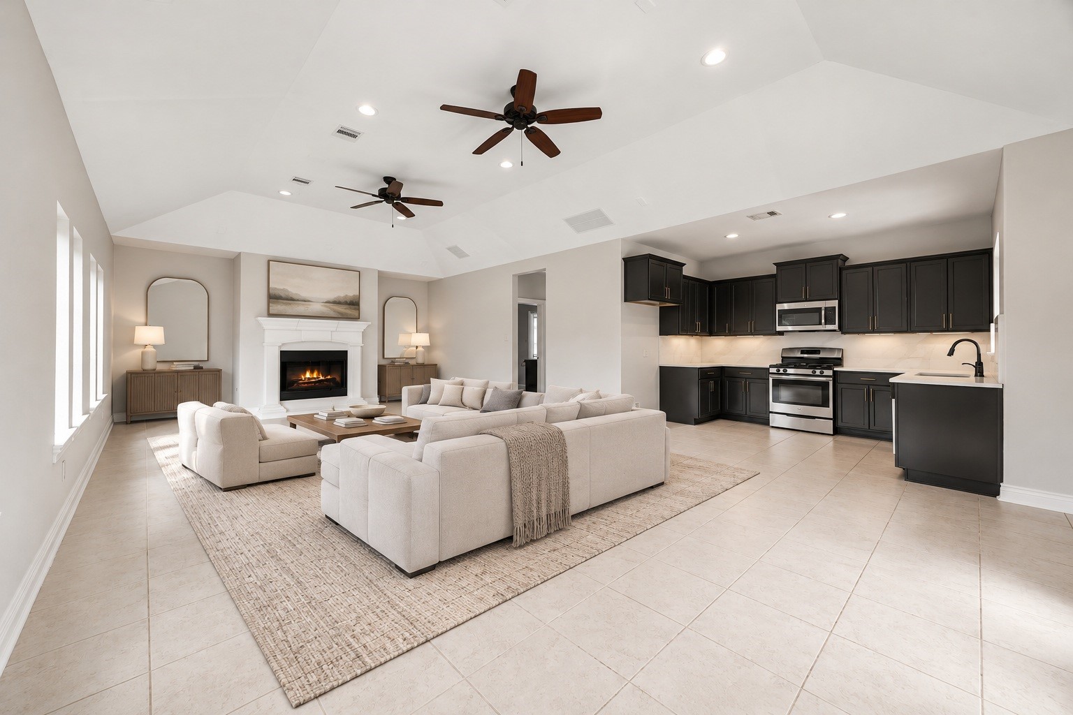 Inside, the open living area impresses with soaring ceilings, dual ceiling fans, and a cozy fireplace, flowing seamlessly into the casitas full kitchen. Virtually staged.