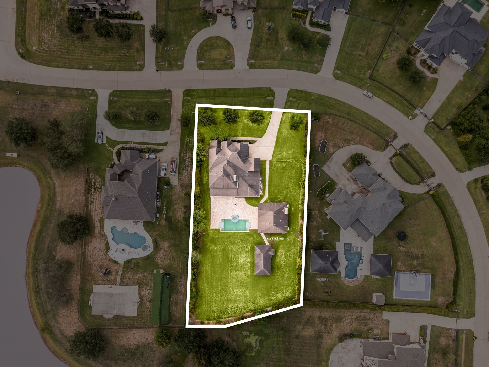 This birds-eye view highlights the true size and shape of the property, showcasing the main home, casita, and pool all situated on this rare, expansive homesite.