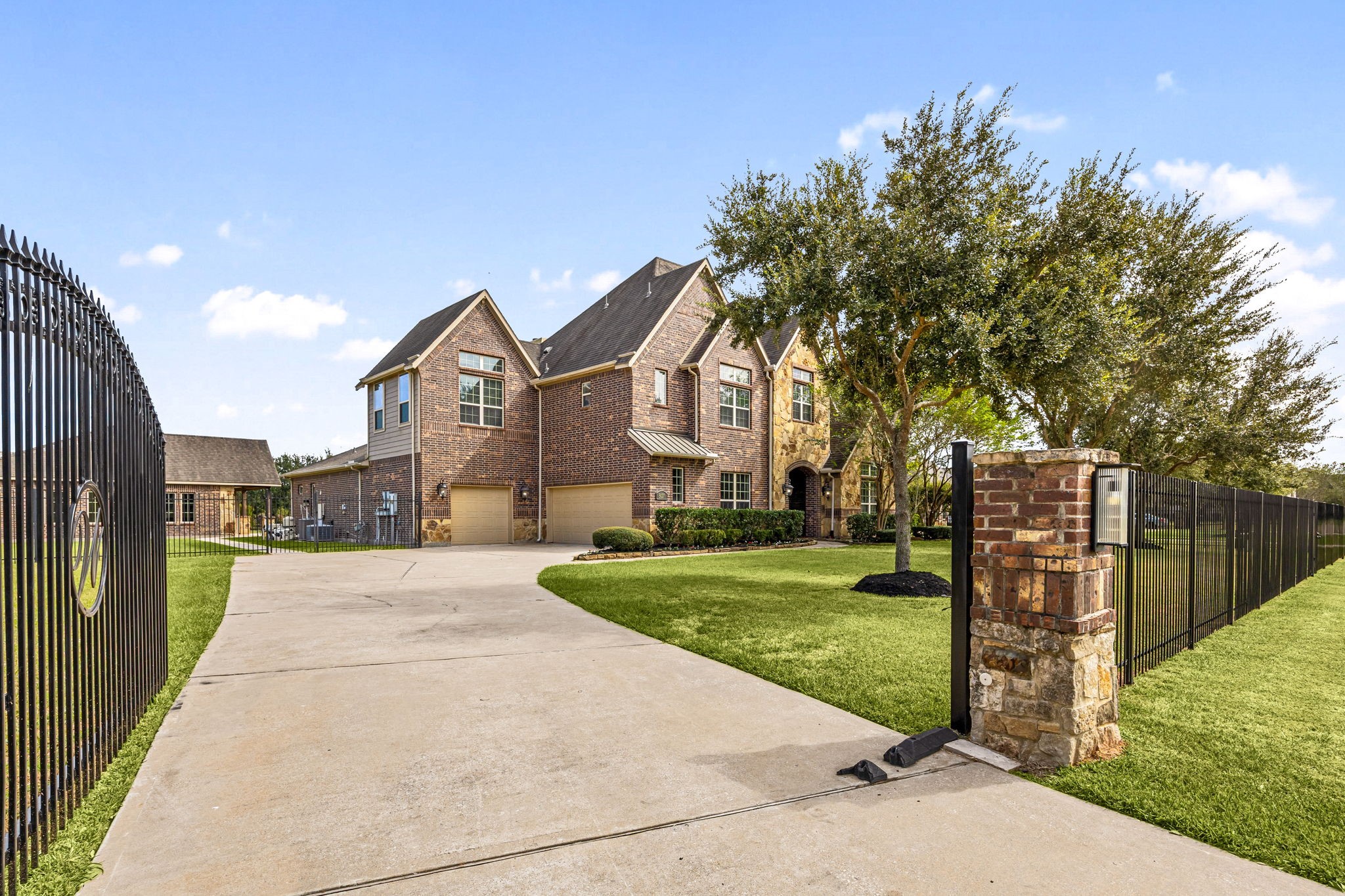 Completing the acre-plus estate, the gated entrance and sweeping driveway provide access to the main residence, three-car garage, and detached casitaall within a private, beautifully maintained setting.