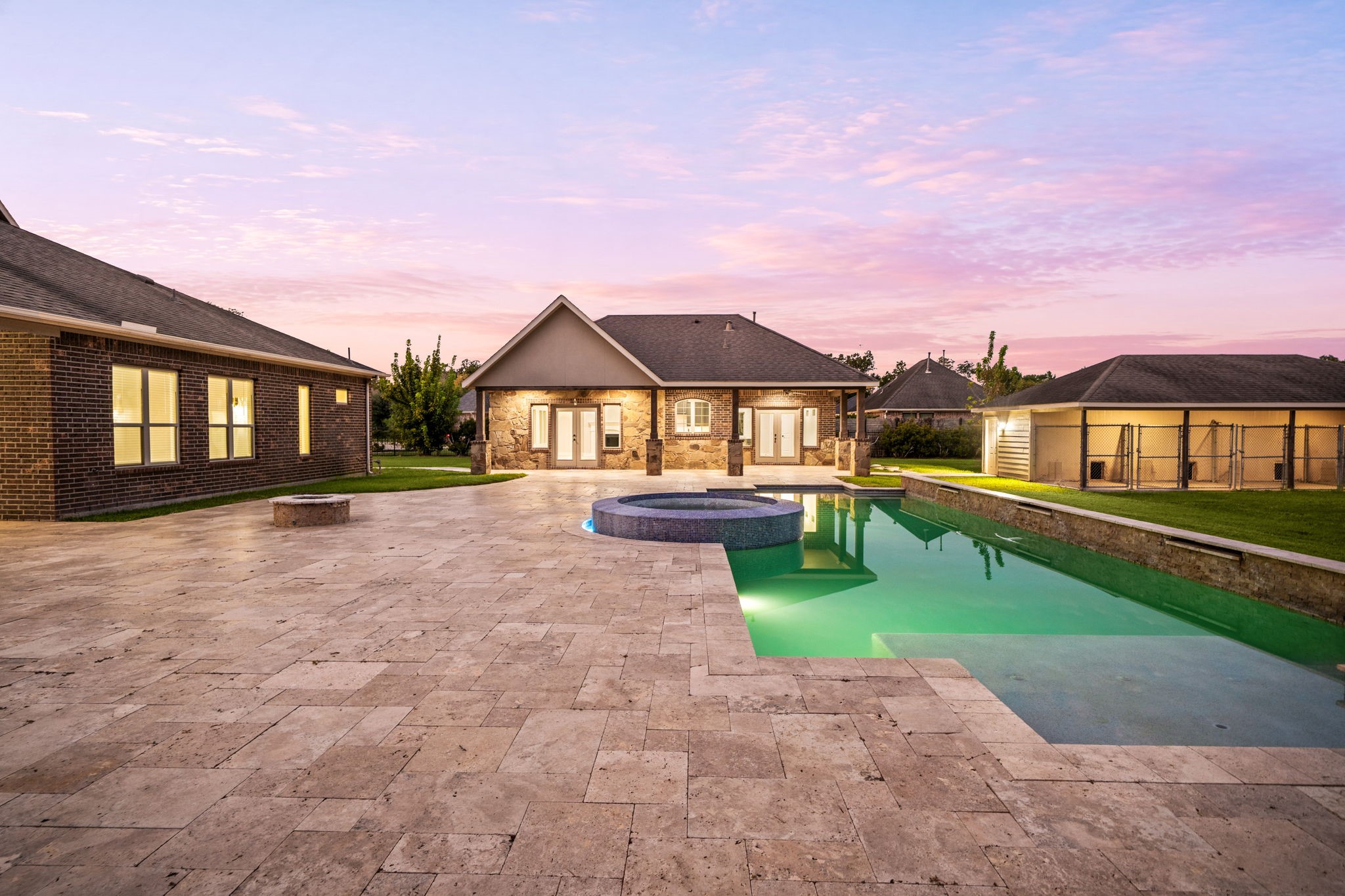 From this angle, the casita and covered grounds come into view, showcasing the true scale and versatility of this exceptional outdoor retreat.
