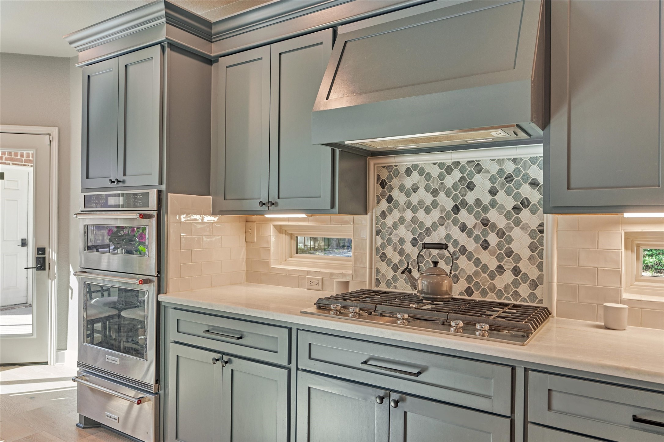 Cooktop with modern tile backsplash