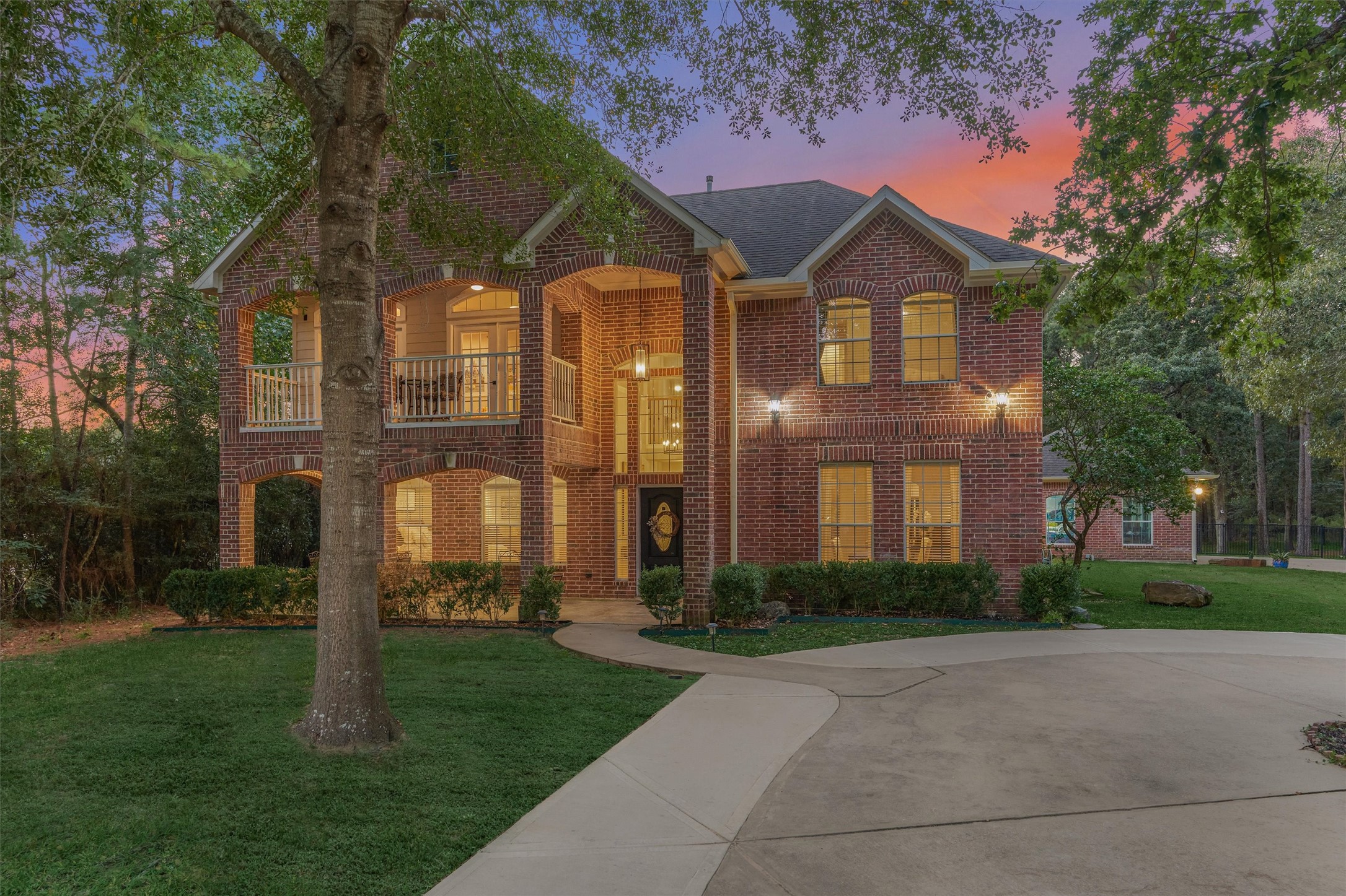 Classic Southern-charm red brick with circular driveway