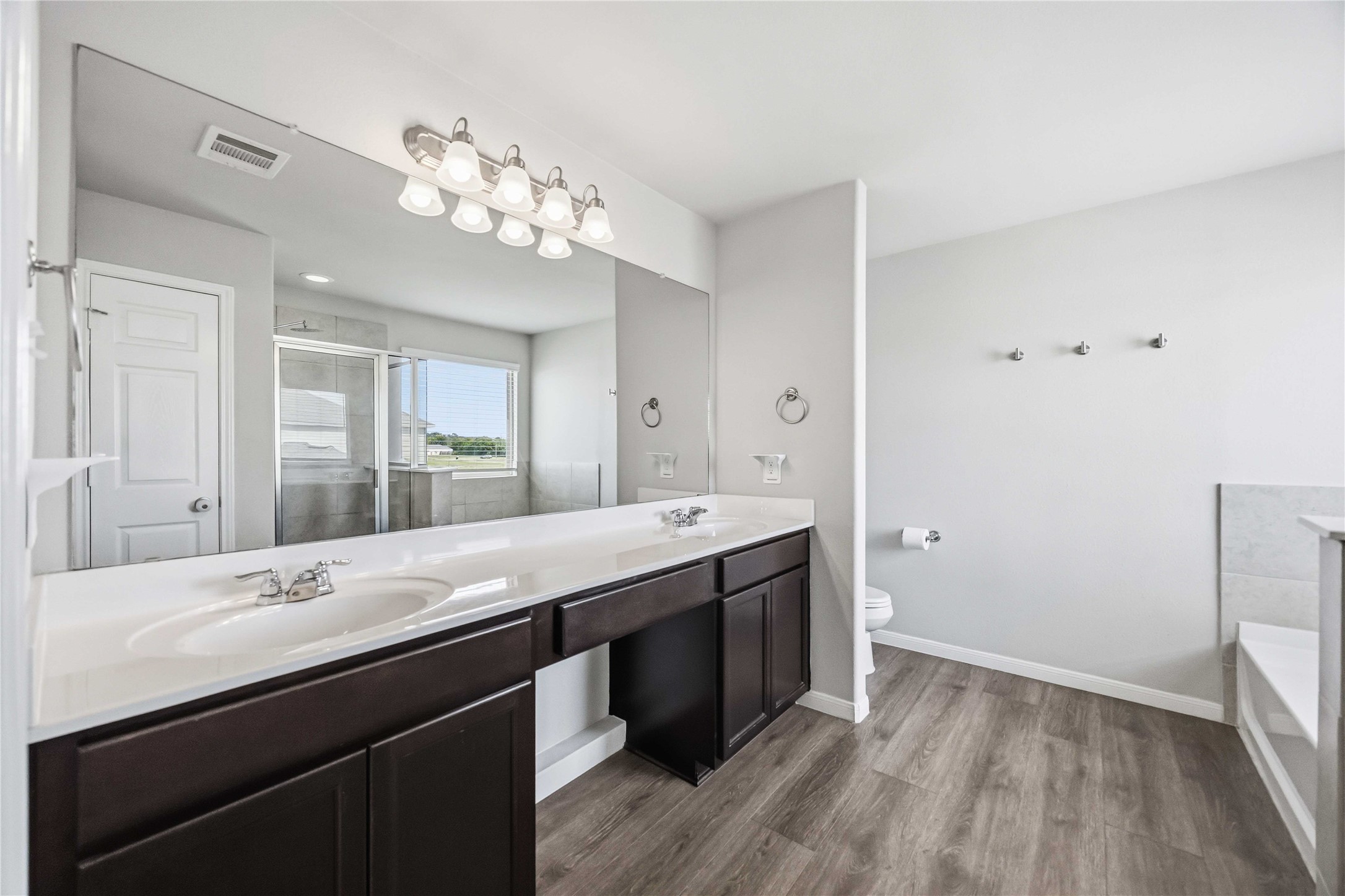 Primary Bathroom w/double sink vanity, stand alone shower and soaking tub!