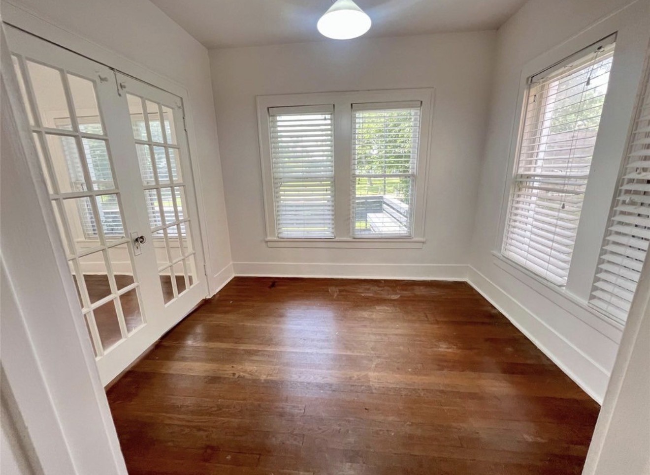 Double doors lead to a flex room that would make a great home office or third bedroom.