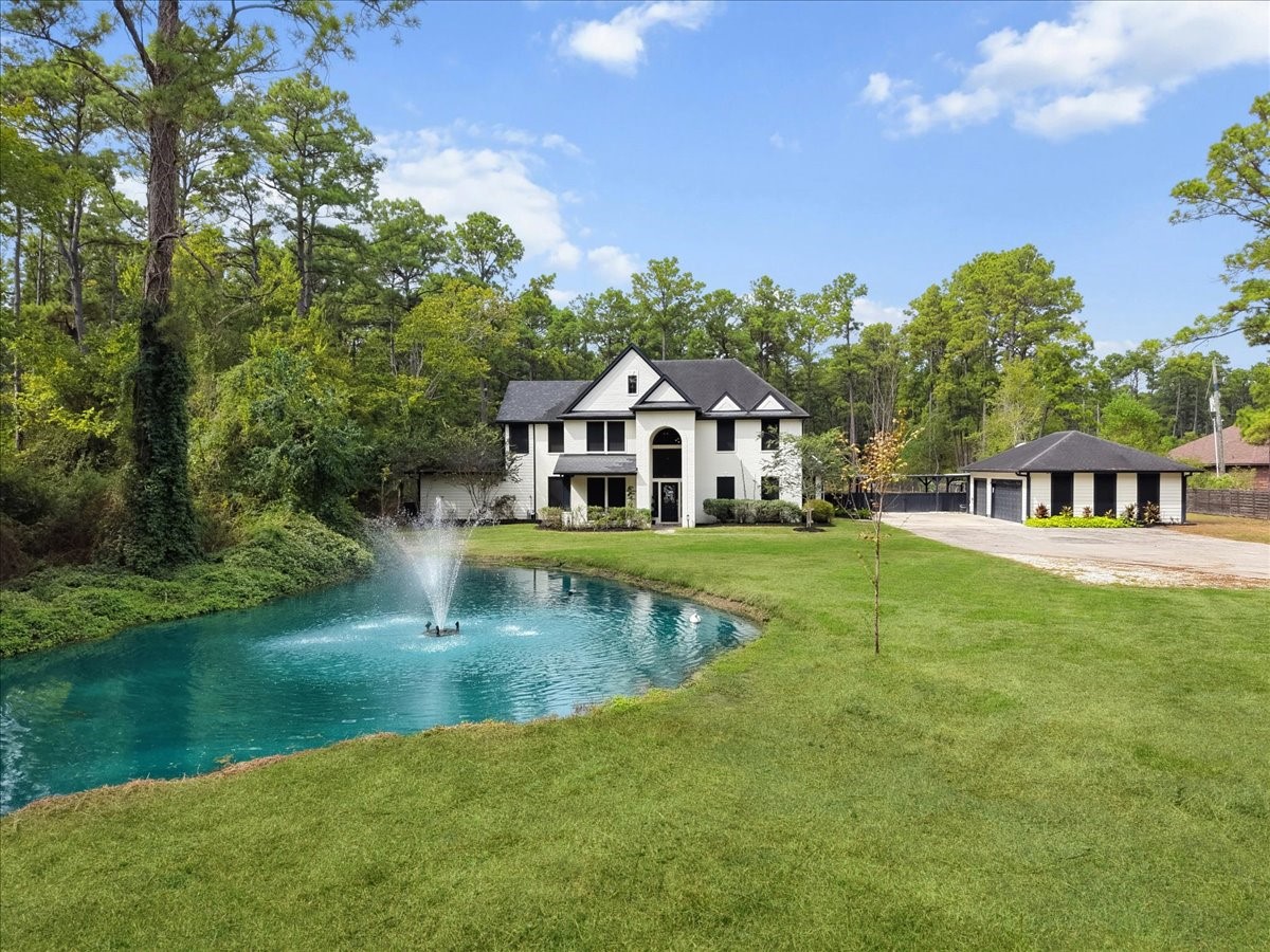 This updated two-story country place, features a detached 3 car garage, also foundation framed for future garage apartment. Stocked pond also has working fountains and lights