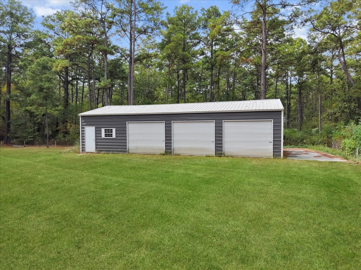 Need a place for your toys or RV hook-up? Enjoy this three bay  25x50 shop has your covered.