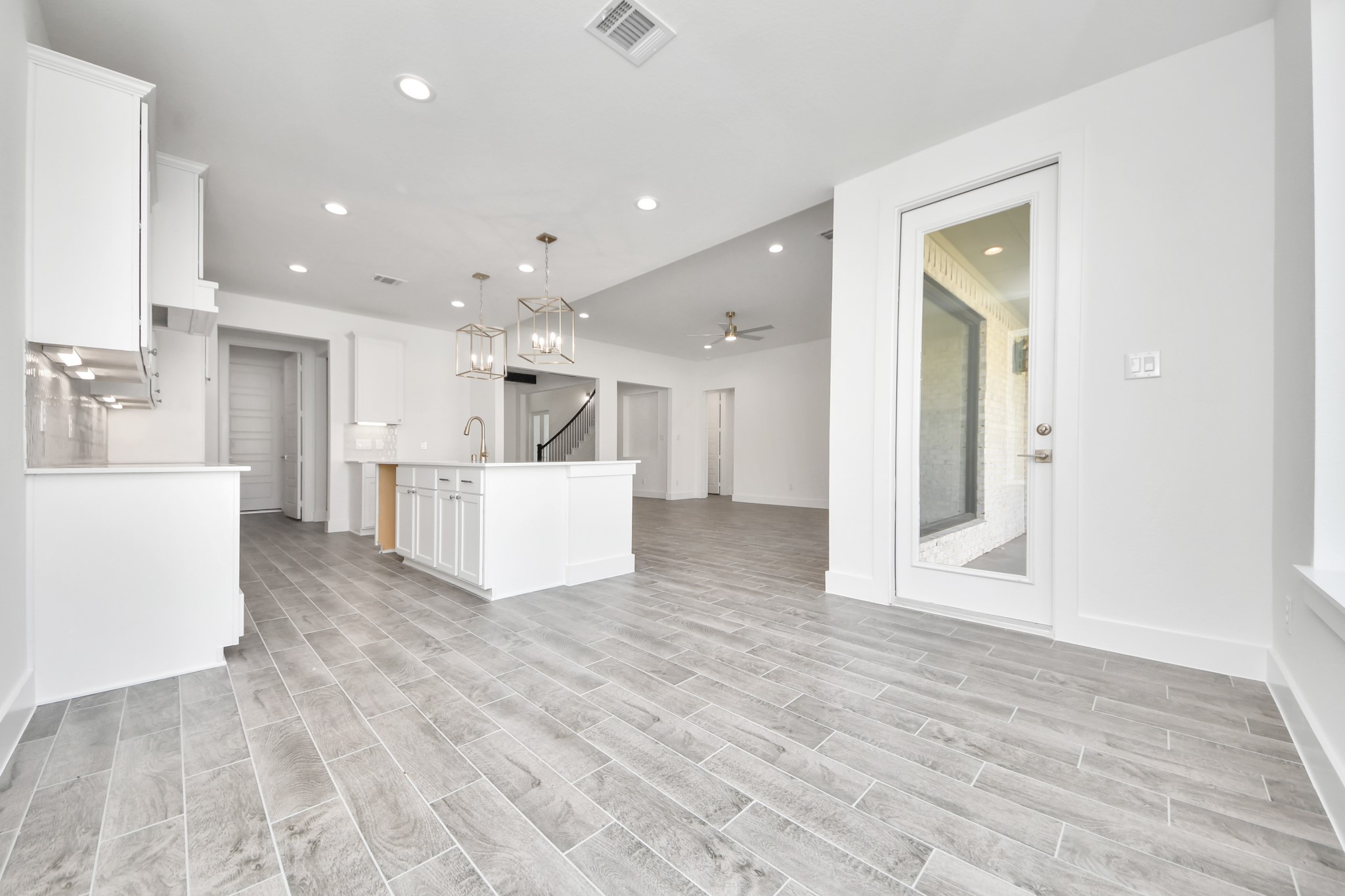 Enjoy breakfast with ease in the connected and cozy breakfast area, seamlessly integrated with the kitchen for utmost convenience. Step through the back door for a breath of fresh air onto the covered patio, extending your living space to the outdoors