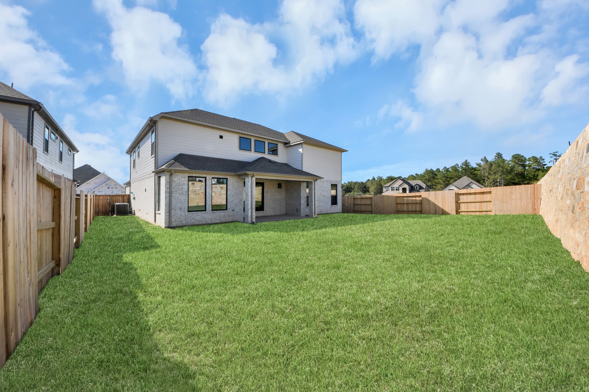 Come and see this spacious backyard with its beautiful covered patio. There is plenty of room for the kids to play and adults to relax. Perfect for your outdoor living space, patio furniture, bbq pit, and so much more. The possibilities are endless!