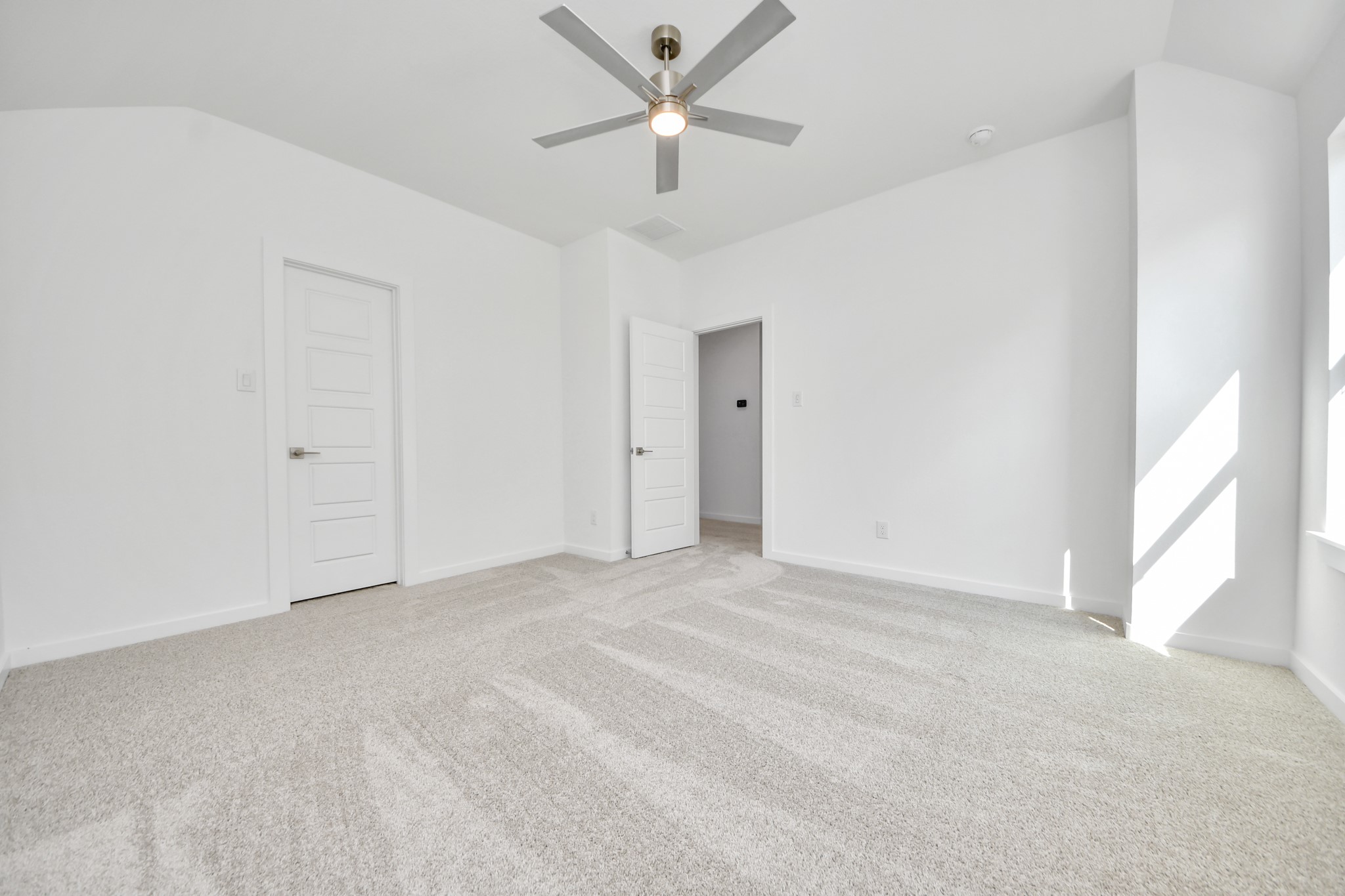 Generously sized secondary bedrooms featuring spacious closets, soft and inviting carpeting underfoot, large windows allowing plenty of natural light, and the added touch of privacy blinds for your personal retreat.