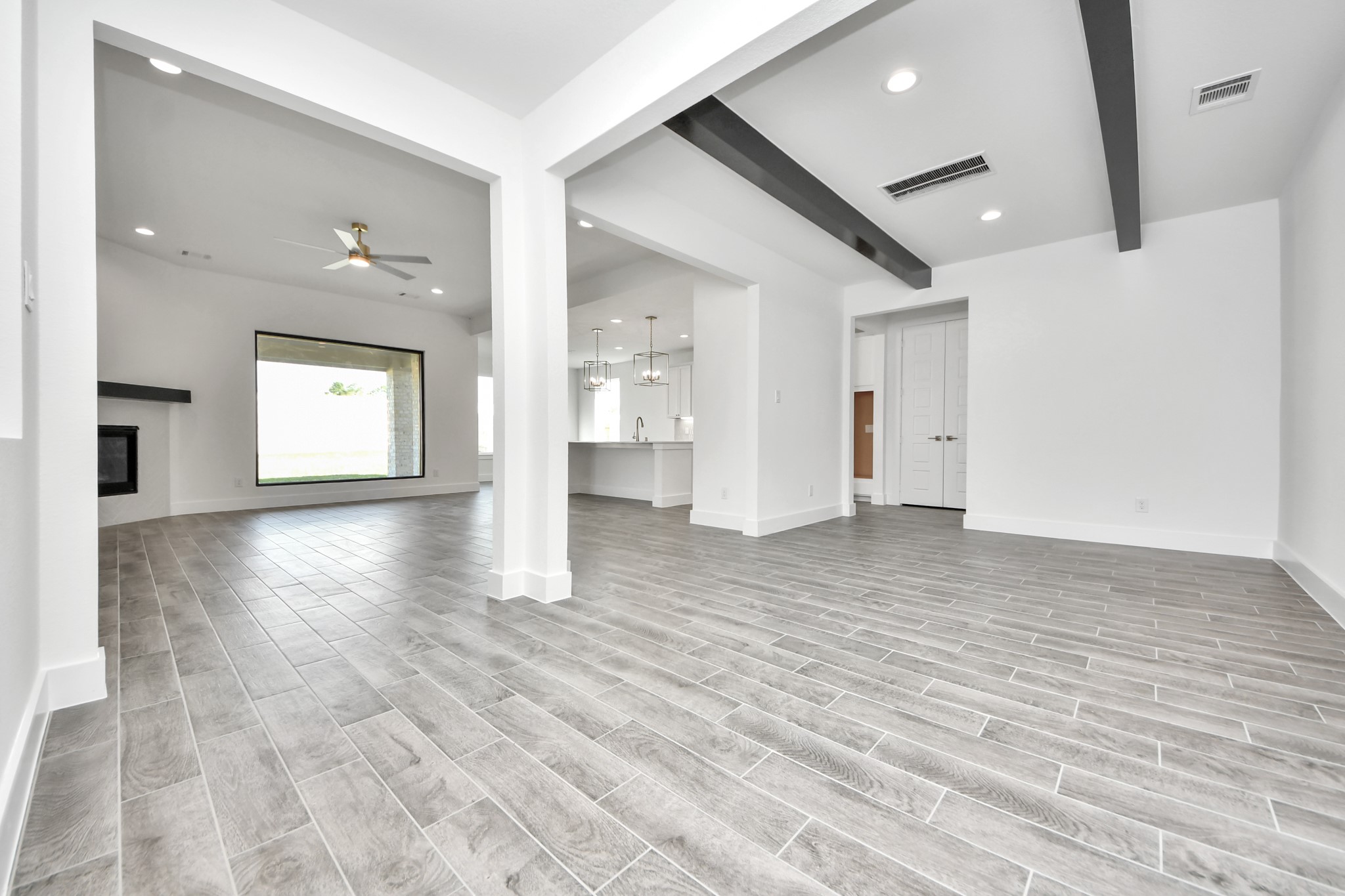 Make memories gathered around the table with your family and friends! This spacious dining room features elegant flooring, custom paint, and adjacent to family room and kitchen for open concept feel.