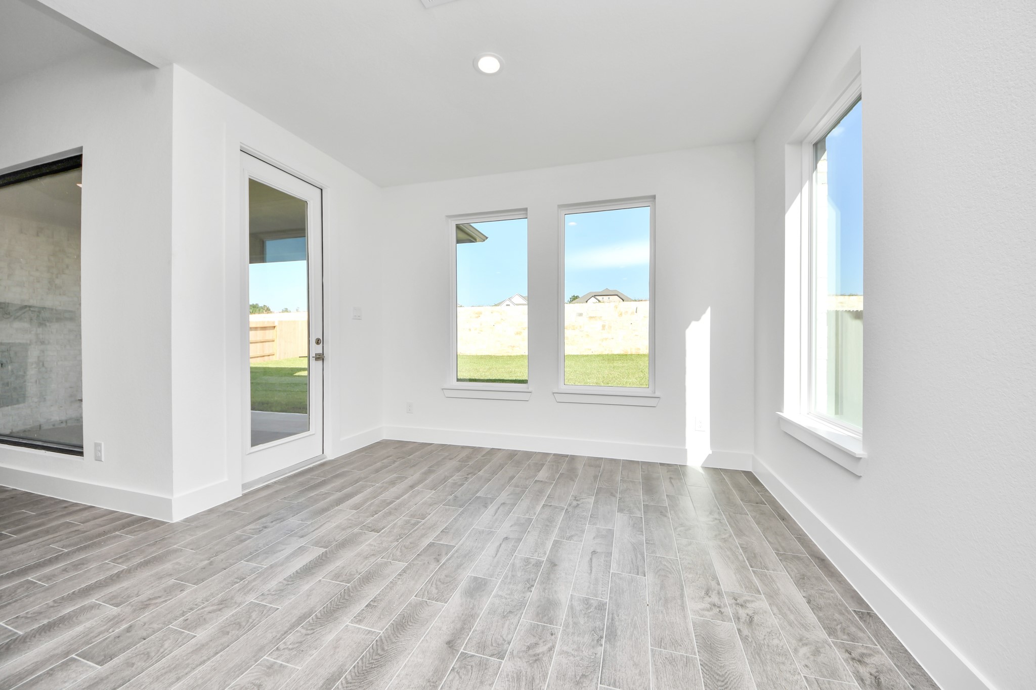 Enjoy breakfast with ease in the connected and cozy breakfast area, seamlessly integrated with the kitchen for utmost convenience. Step through the back door for a breath of fresh air onto the covered patio, extending your living space to the outdoors