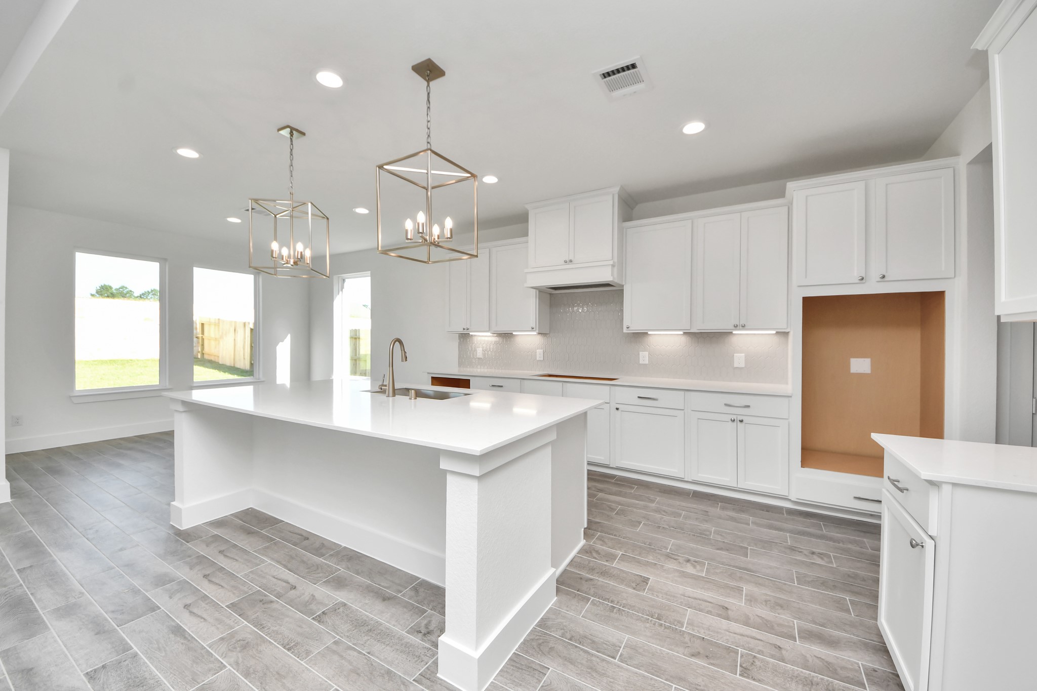 The kitchen is a culinary haven, featuring granite countertops, a tile backsplash, stainless steel appliances, 42 upper cabinets, and undercabinet lighting.