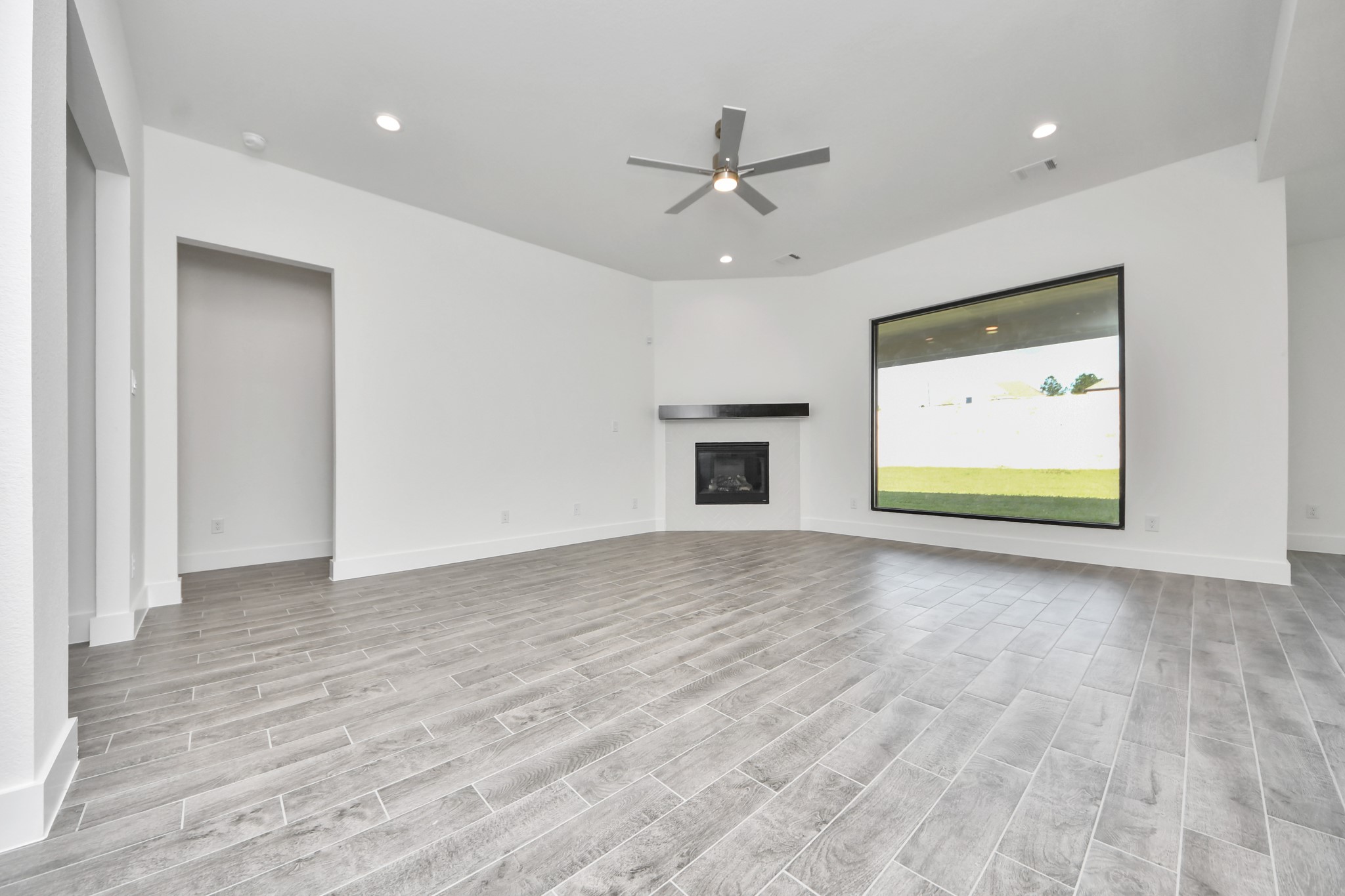 Take another glimpse into the heart of the home with this additional view of the family rooma sprawling space ready to accommodate all your gatherings.