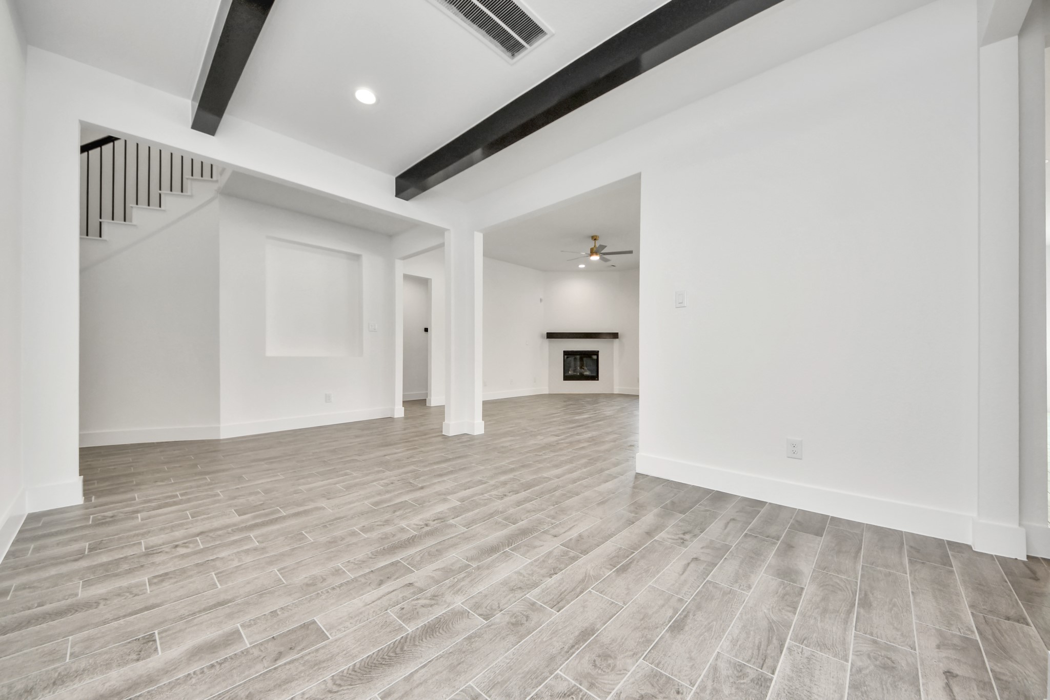 Create lasting memories with your family and friends at the dining table! This expansive dining room showcases sophisticated flooring, custom paint, and seamlessly connects to the family room and kitchen, providing an open and inviting atmosphere