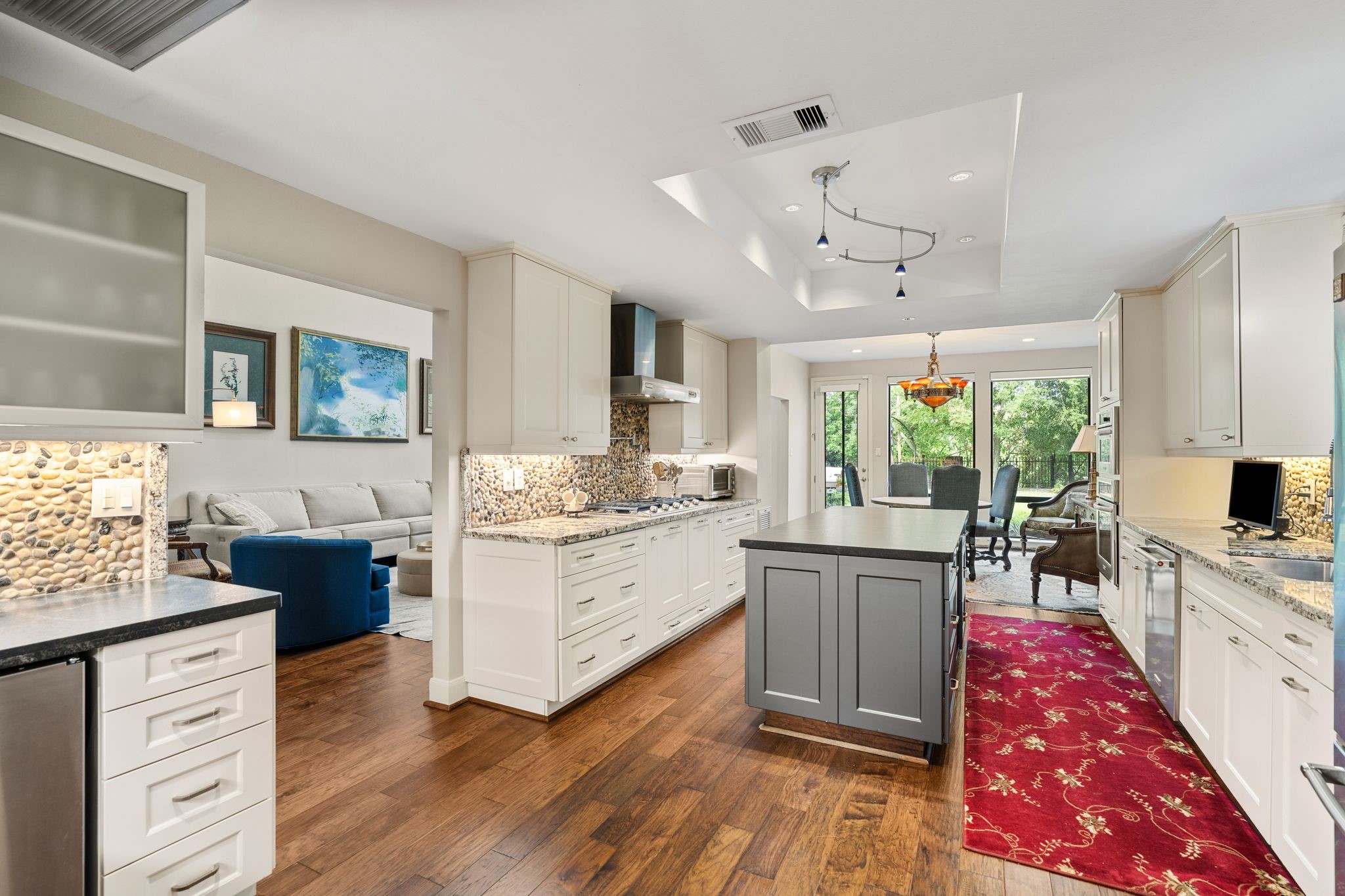 Open connections to the living room and breakfast area keep the kitchen at the center of everyday living and entertaining.