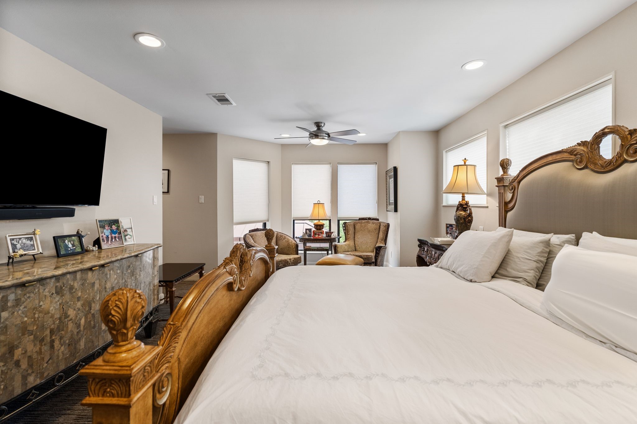 A sitting nook within the primary bedroom offers a comfortable place for morning coffee, reading or quiet conversation.