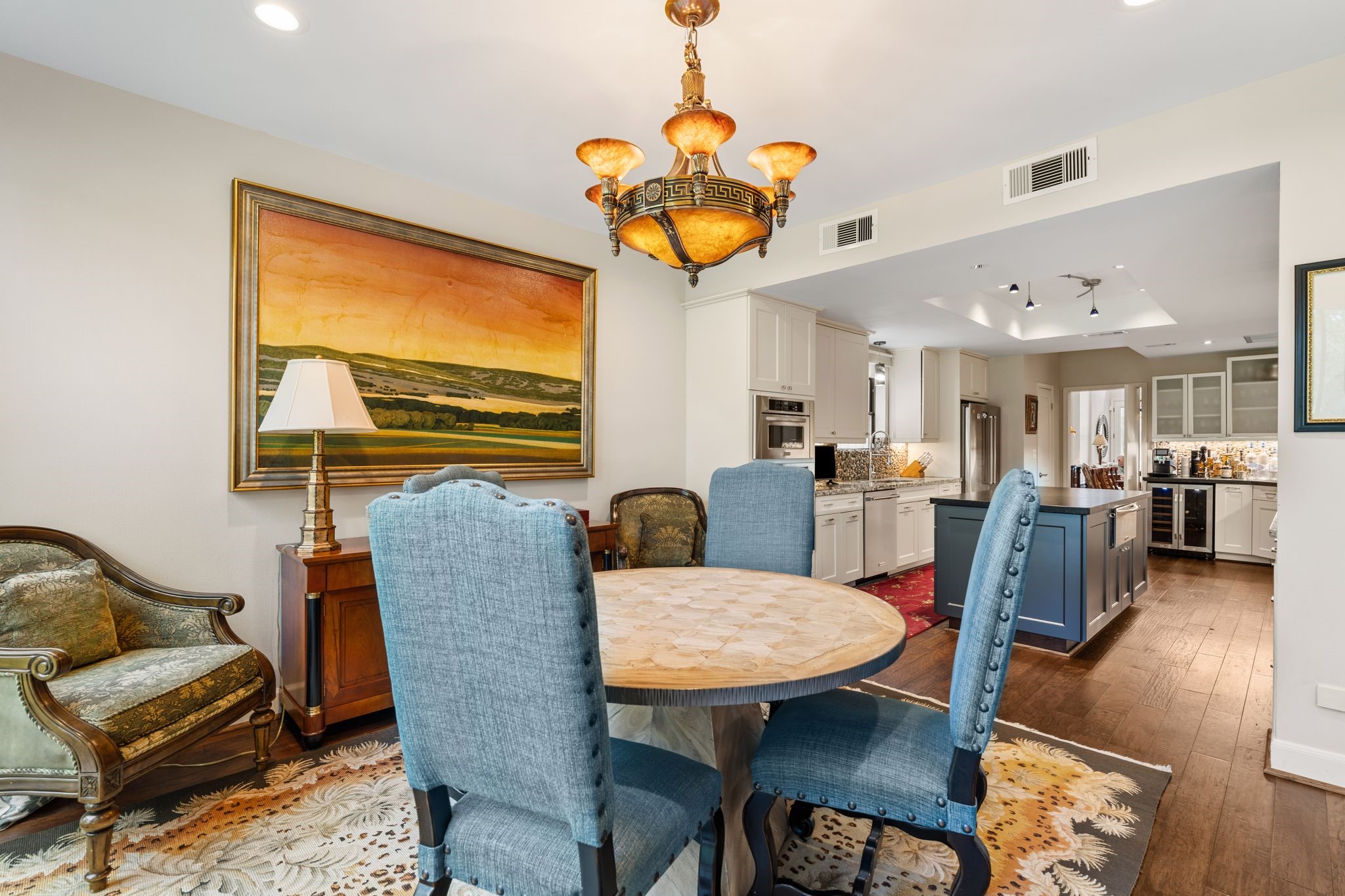 The breakfast area flows directly into the island kitchen, creating a convenient arrangement for everyday meals and casual gatherings.