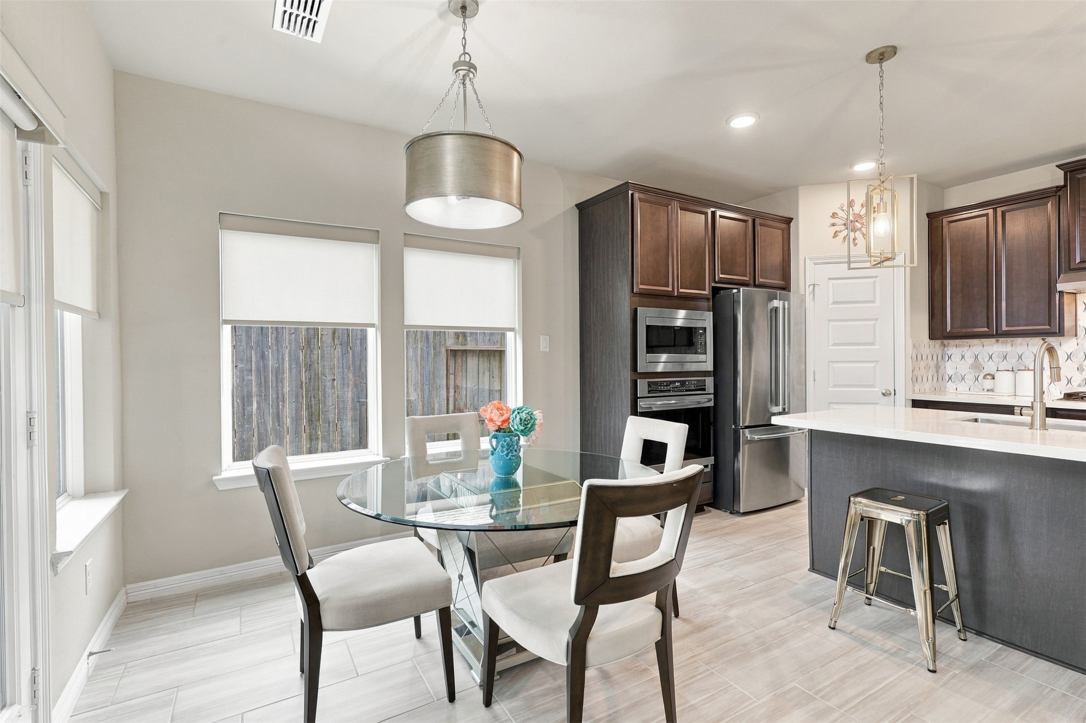 THE HEART OF THE HOME & AN ABSOLUTE SHOWSTOPPER! Imagine the joy of gathering in this SPECTACULAR gourmet kitchen and sun-filled breakfast area, where beautiful design meets everyday luxury! Gorgeous rich cabinetry, gleaming quartz countertops, stunning built-in stainless-steel appliances, and a MASSIVE center island with gas cooktop create a DREAM kitchen for cooking and entertaining!