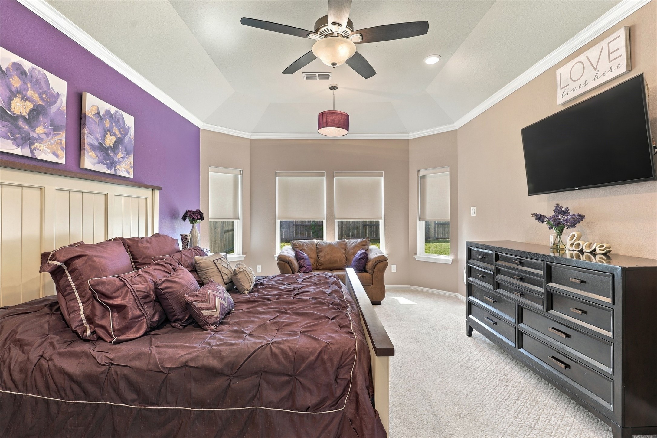 What an AMAZING PRIVATE PRIMARY RETREAT! Tucked away on the first floor, this spacious suite features a wonderful sitting area, elegant high tray ceilings, and beautiful custom upgraded window treatments! The perfect place to relax, unwind, and enjoy your own peaceful escape!