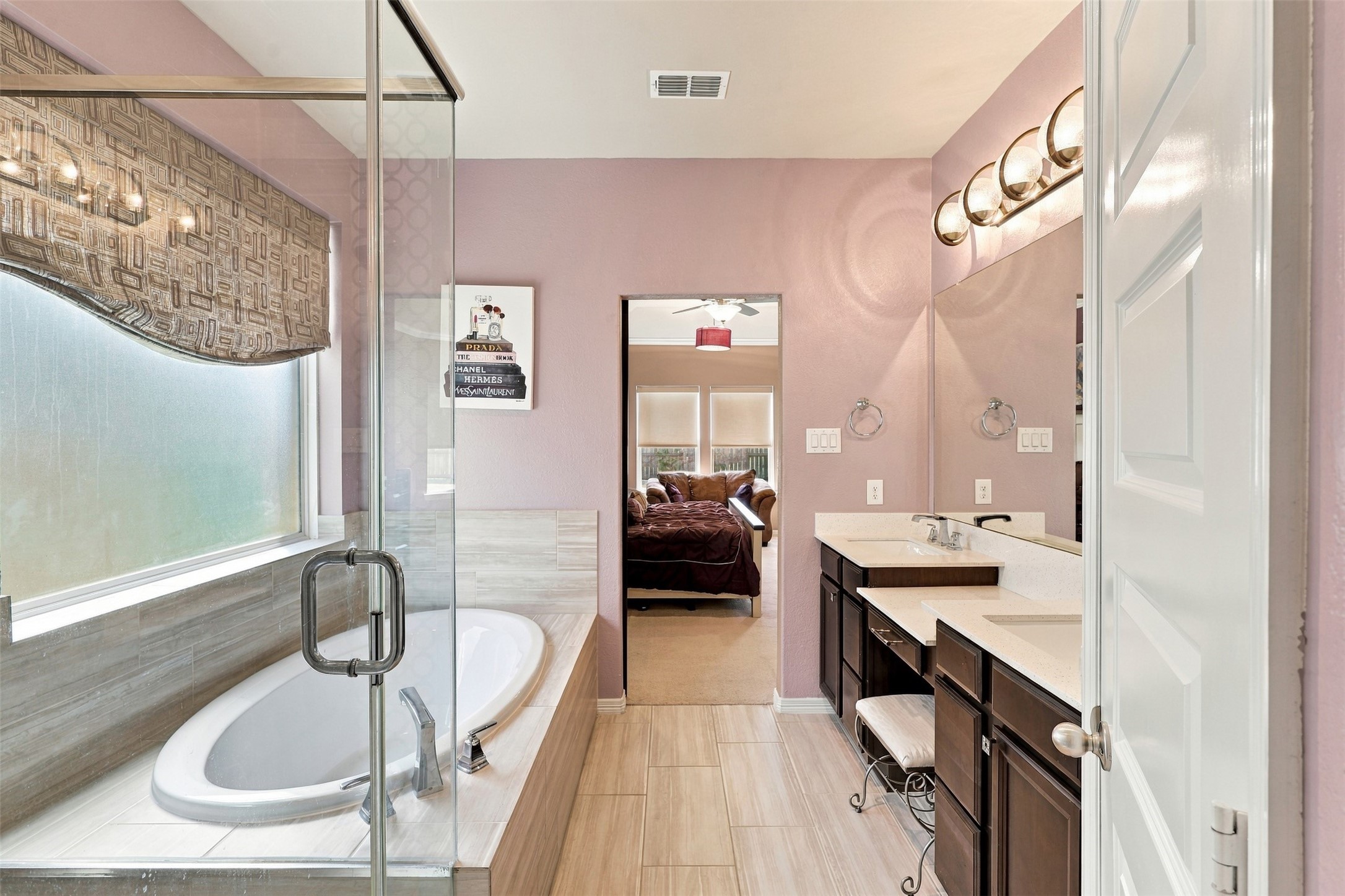 WOW! Prepare to FALL IN LOVE with this BREATHTAKING primary bathroom, designed for ultimate relaxation and everyday indulgence! Step into the SPECTACULAR seamless glass walk-in shower, or imagine sinking into the magnificent deep, oversized soaking tub, surrounded by warm bubbles as the stresses of the day simply melt away! Enjoy the convenience of a spacious linen pantry, perfect for keeping plush towels and all your spa essentials beautifully organized!