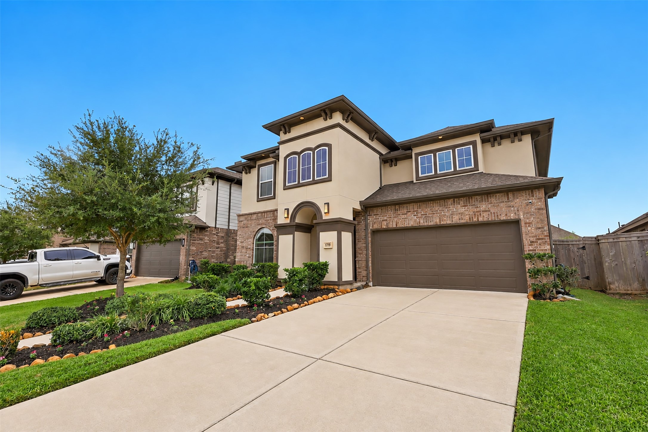 WOW! CURB APPEAL AT ITS FINEST! Prepare to FALL IN LOVE with this stunning home showcasing beautiful architectural details, lush manicured landscaping, gorgeous flower beds & a picture-perfect green lawn! The spacious driveway & inviting grand entry to create an unforgettable first impression! Enjoy the beauty of a sprinkler system throughout! A SPECTACULAR place to call HOME! Open the door to your memories today!